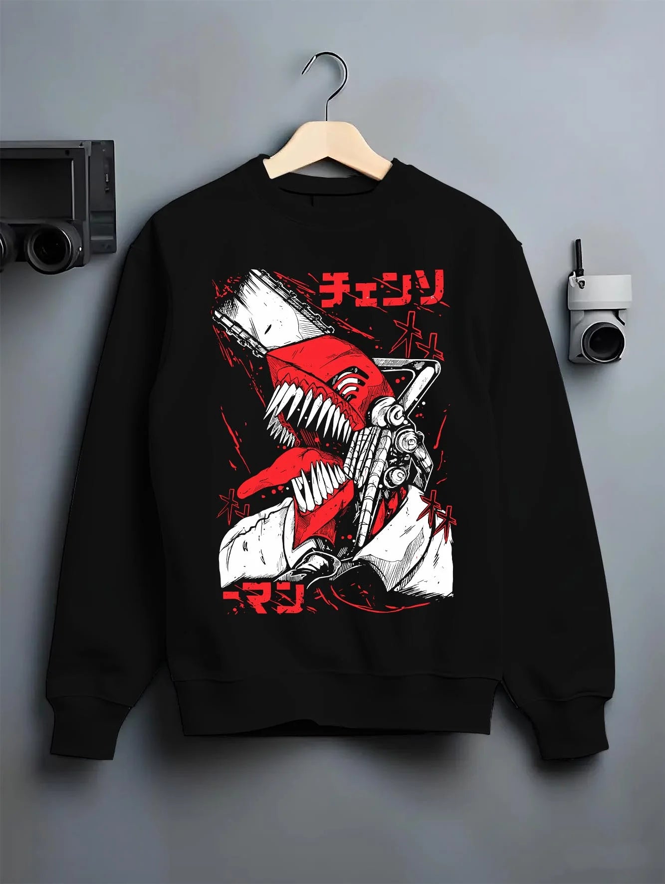 Black crewneck sweatshirt on hanger with Chainsaw Man Hoodie Denji Devil Hunter Red Panel graphic Denji anime design.