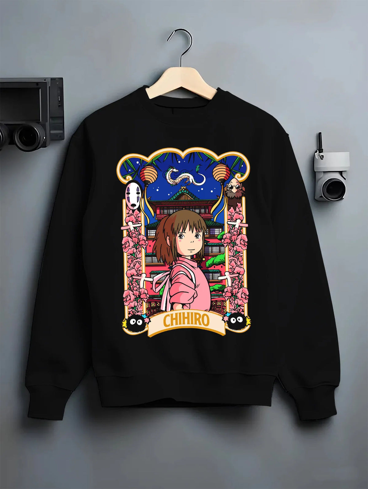 Black crewneck sweatshirt on hanger showing Chihiro Ogino and No-Face from Spirited Away: Japanese poster