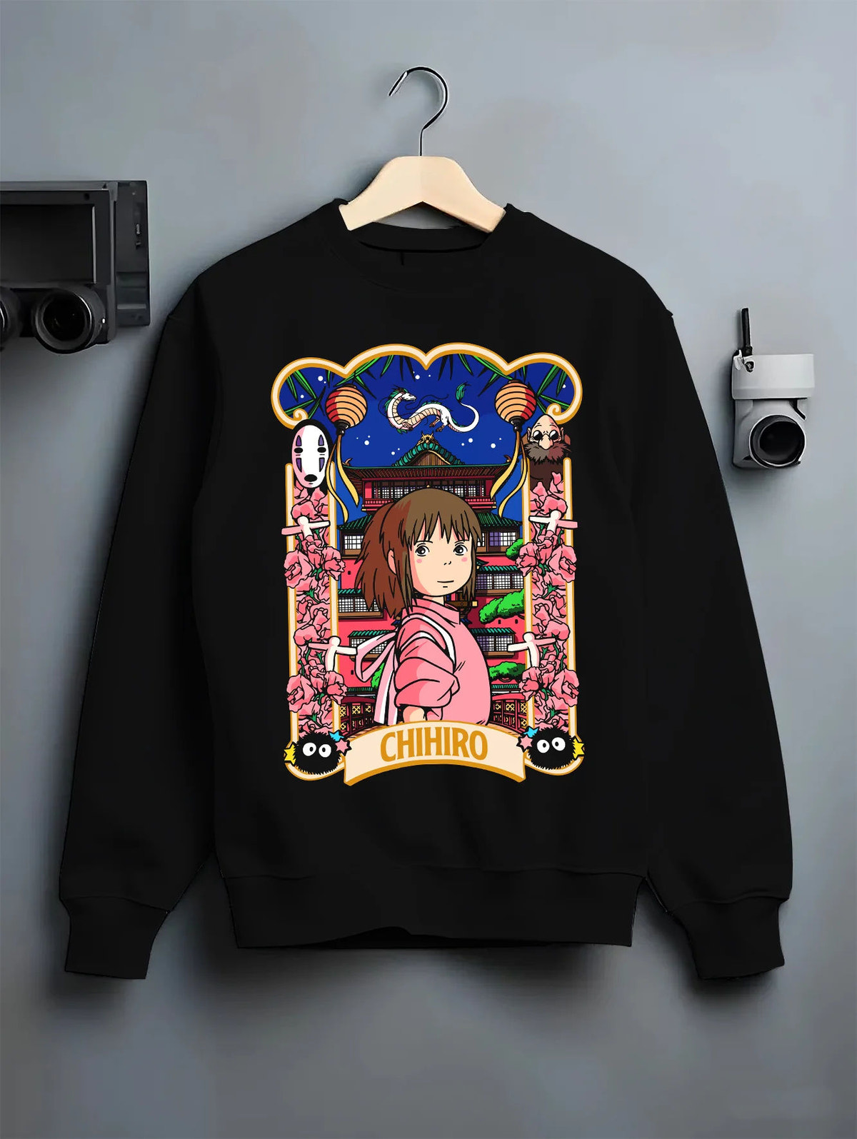 Black crewneck sweatshirt on hanger showing Chihiro Ogino and No-Face from Spirited Away: Japanese poster