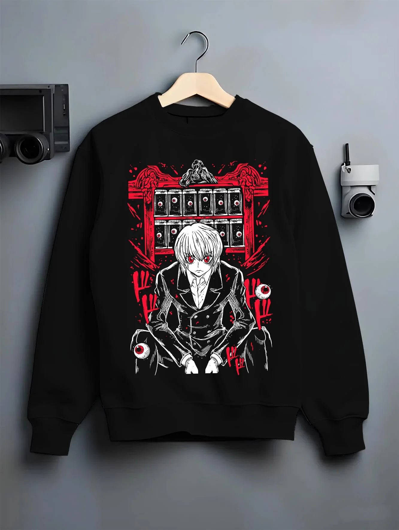 Black crewneck sweatshirt on hanger with Hunter x Hunter Kurapika Hoodie Chain User Jumper graphic bold anime graphic.