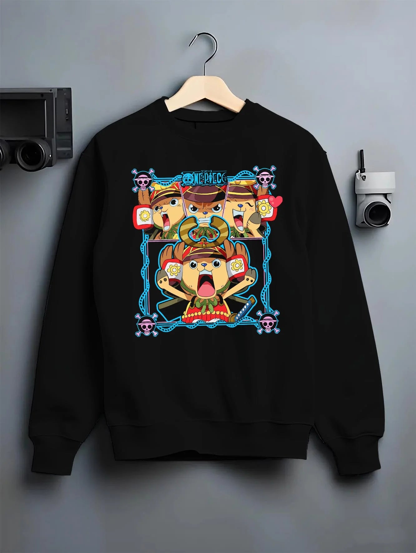Black crewneck sweatshirt on hanger with Chopper Hoodie One Piece Doctor Pirate Retro Symbol graphic premium wear.