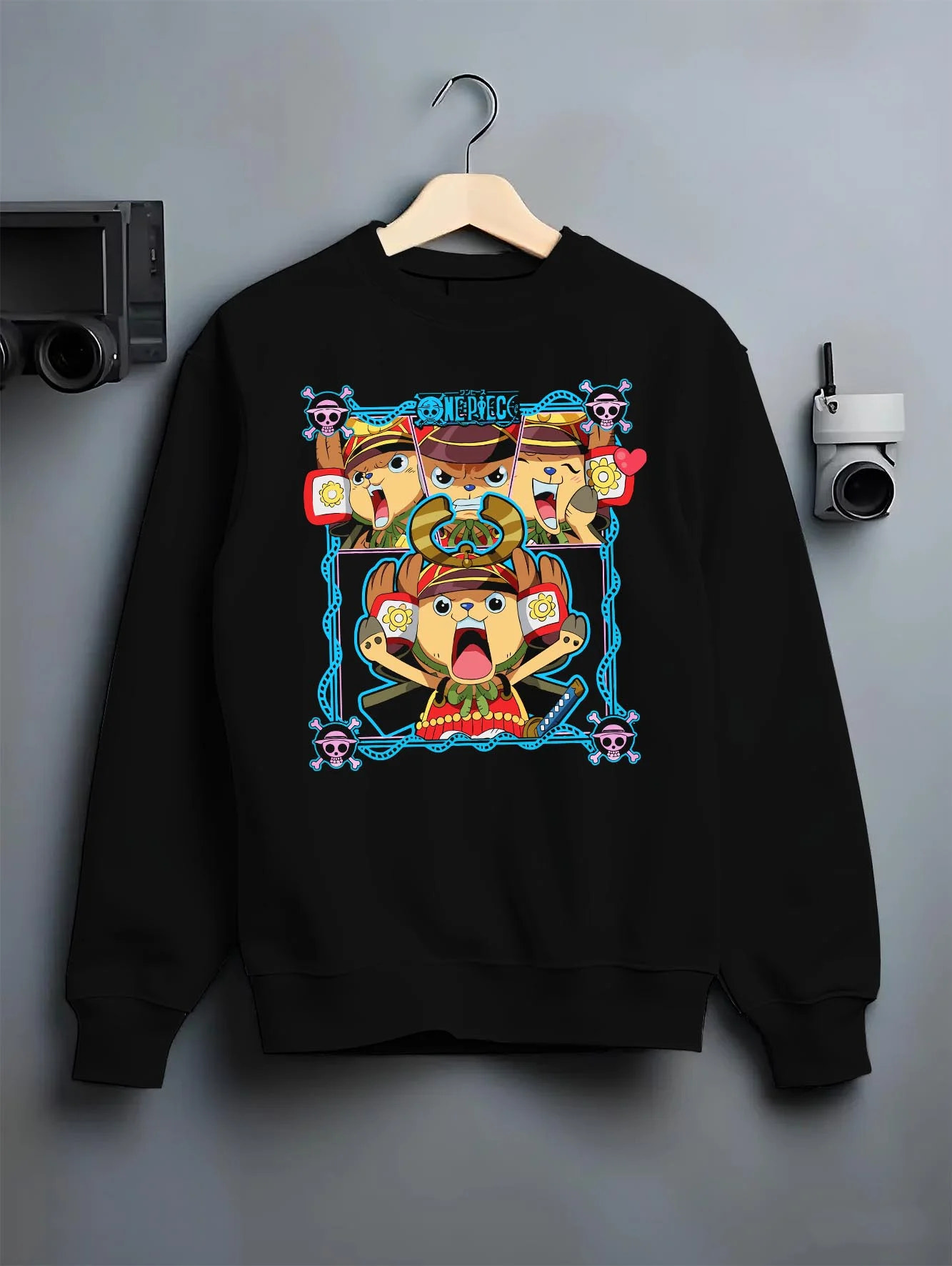 Black crewneck sweatshirt on hanger with Chopper Hoodie One Piece Doctor Pirate Retro Symbol graphic premium wear.