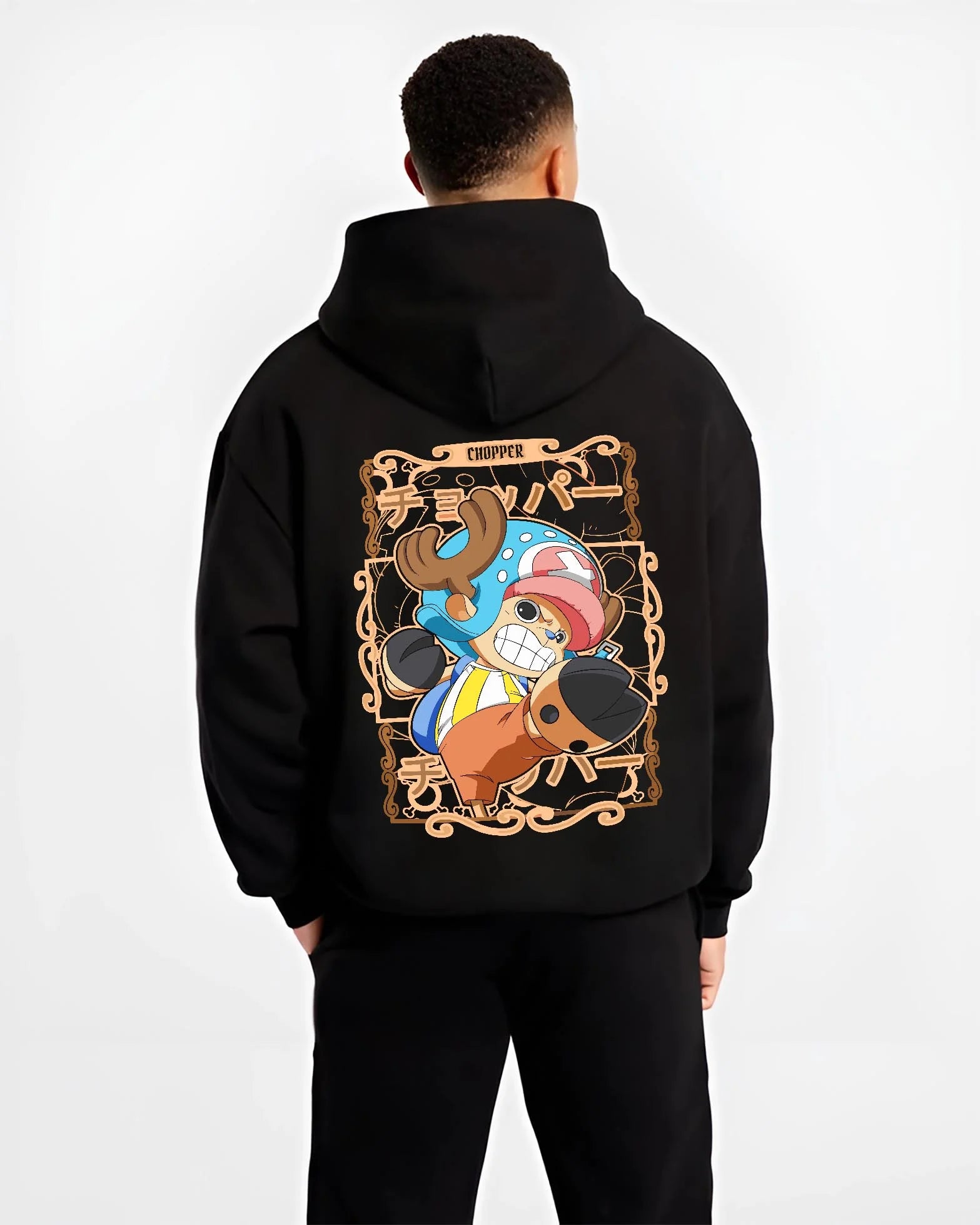Black hoodie worn by male model, back view with Chopper Hoodie One Piece Doctor Small Smirk Panel graphic bold anime graphic.