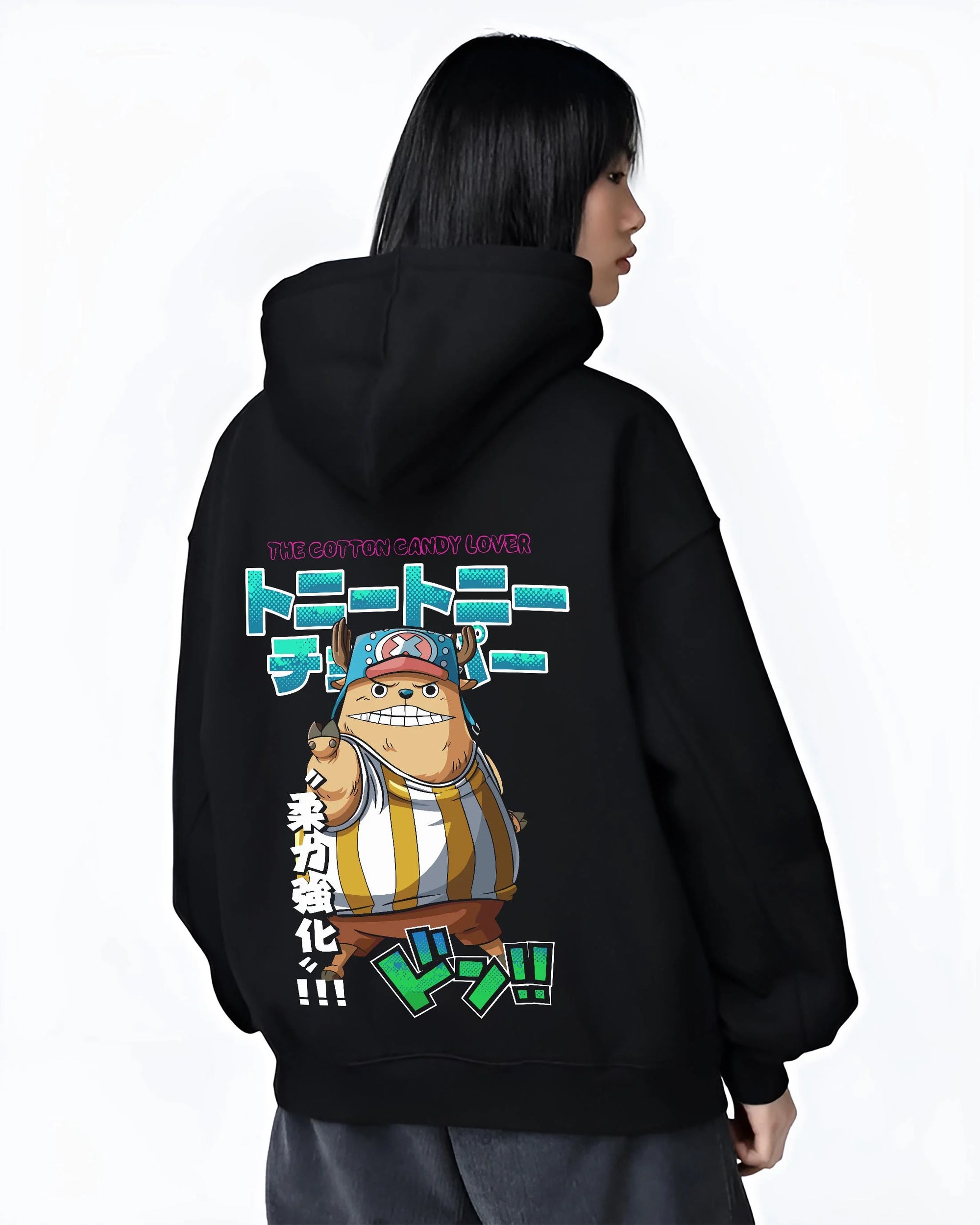 Black hoodie worn by female model, back view with Chopper Hoodie One Piece Pirate Straw Hat Crew Hero graphic streetwear graphic.