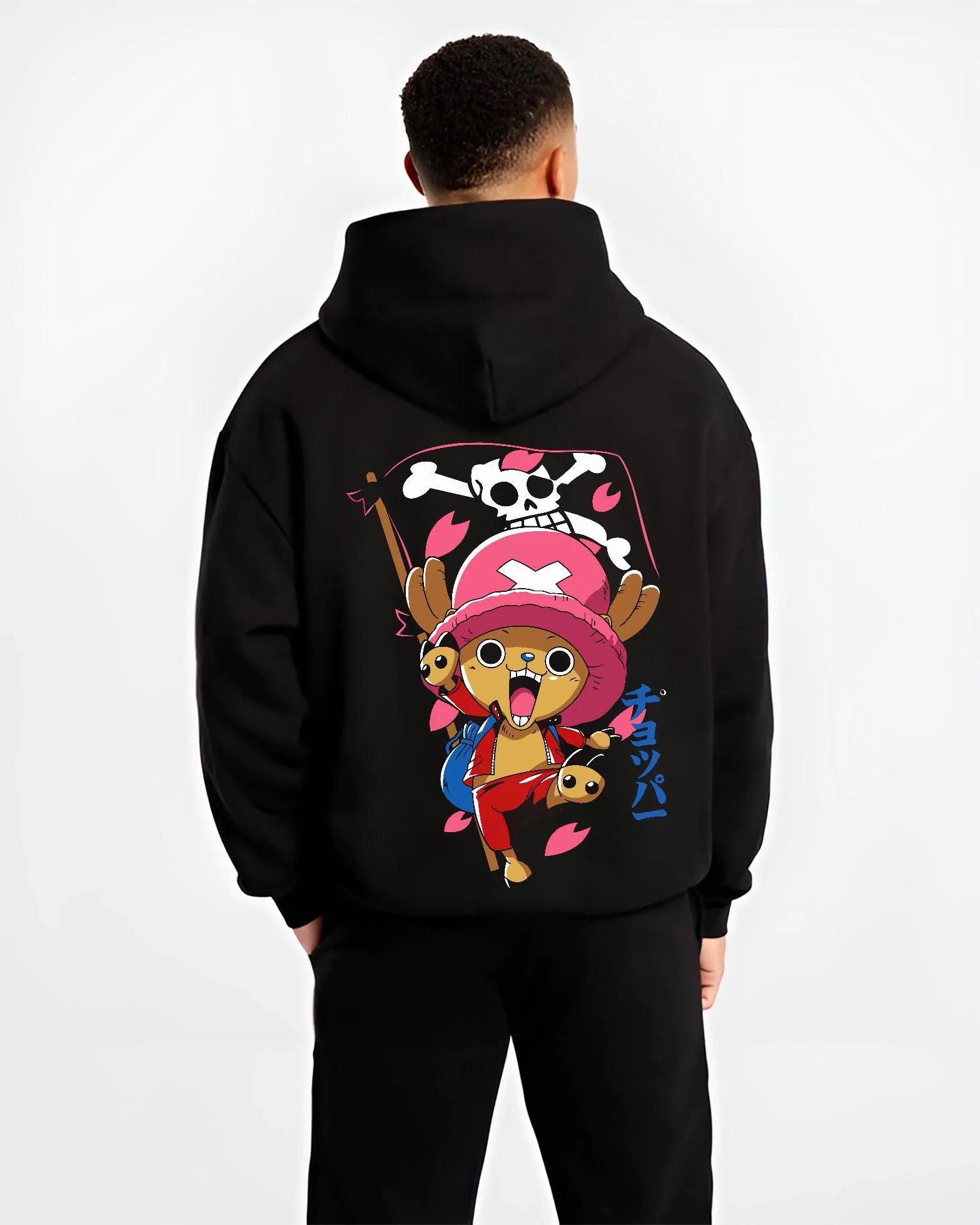 Black hoodie worn by male model, back view with Chopper Hoodie One Piece Doctor Pink Hat Skull Mark graphic streetwear graphic.