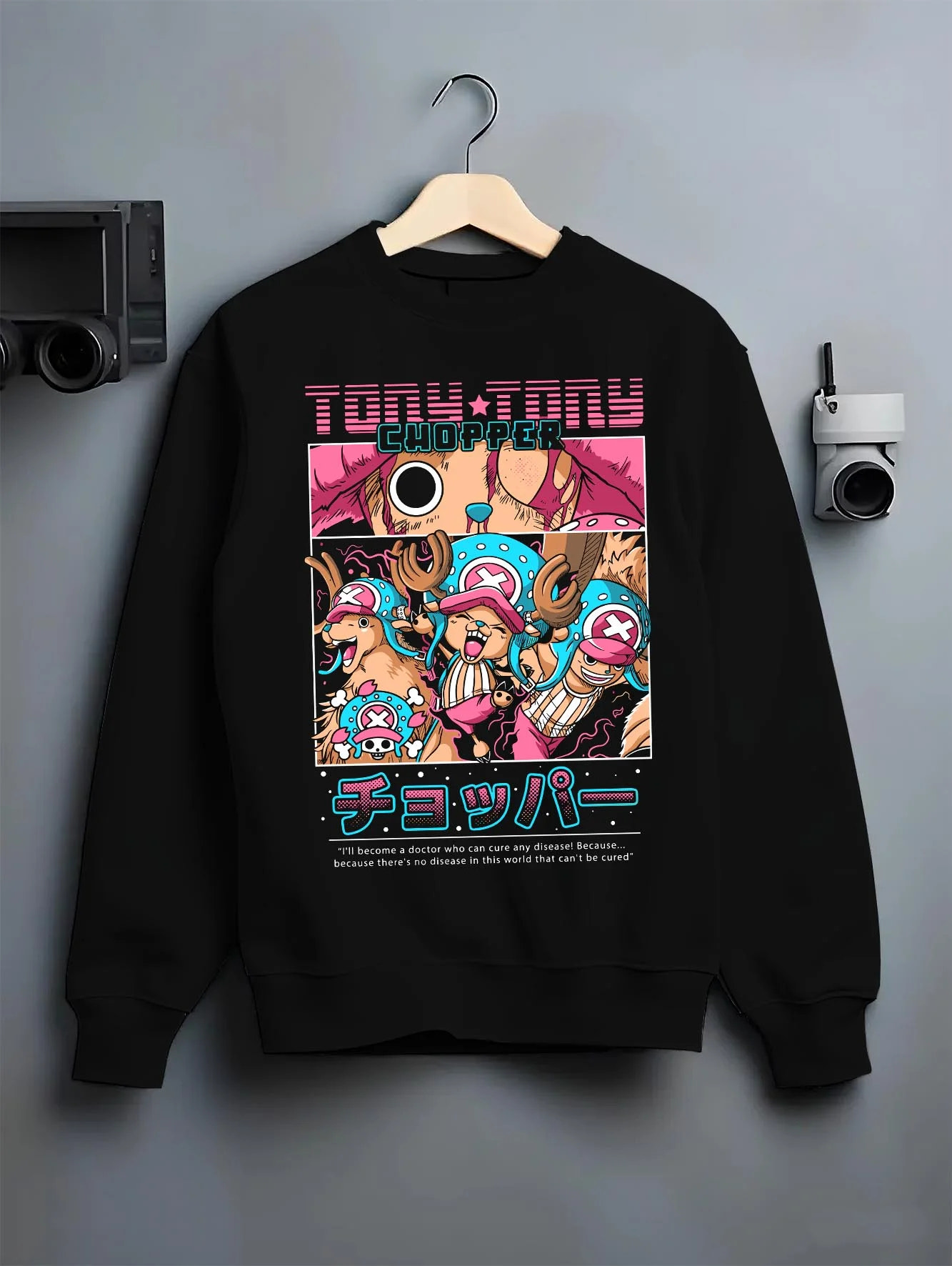 Black crewneck sweatshirt on hanger with Chopper Hoodie One Piece Doctor Retro Pirate Collage graphic streetwear graphic.