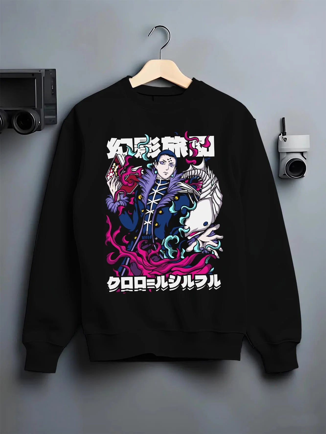 Black crewneck sweatshirt on hanger with Chrollo Hoodie Hunter x Hunter Phantom Troupe Leader graphic bold anime graphic.