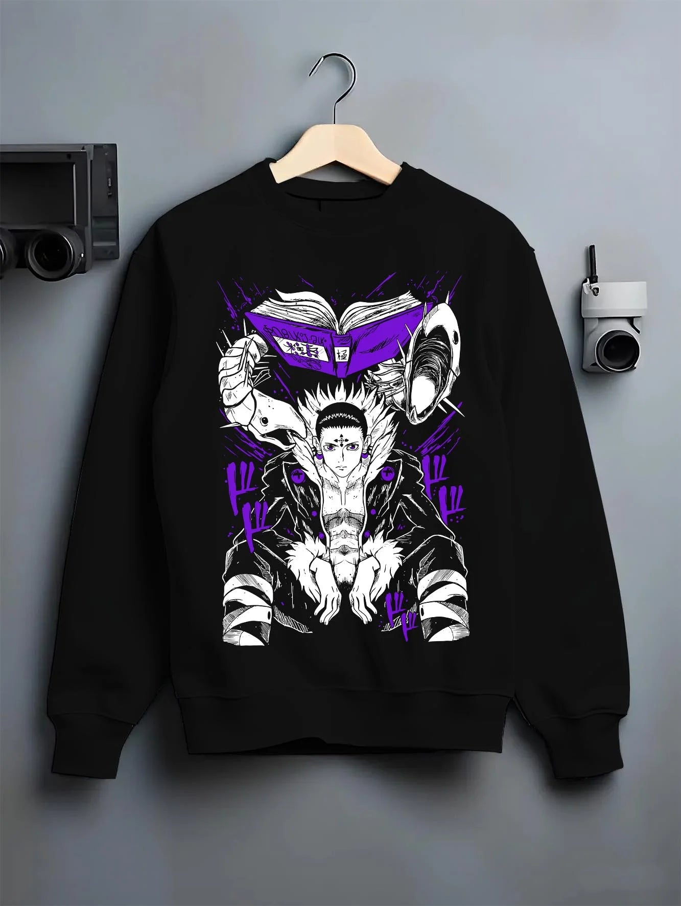 Black crewneck sweatshirt on hanger with Chrollo Hoodie Hunter x Hunter Phantom Troupe Leader graphic bold anime graphic.
