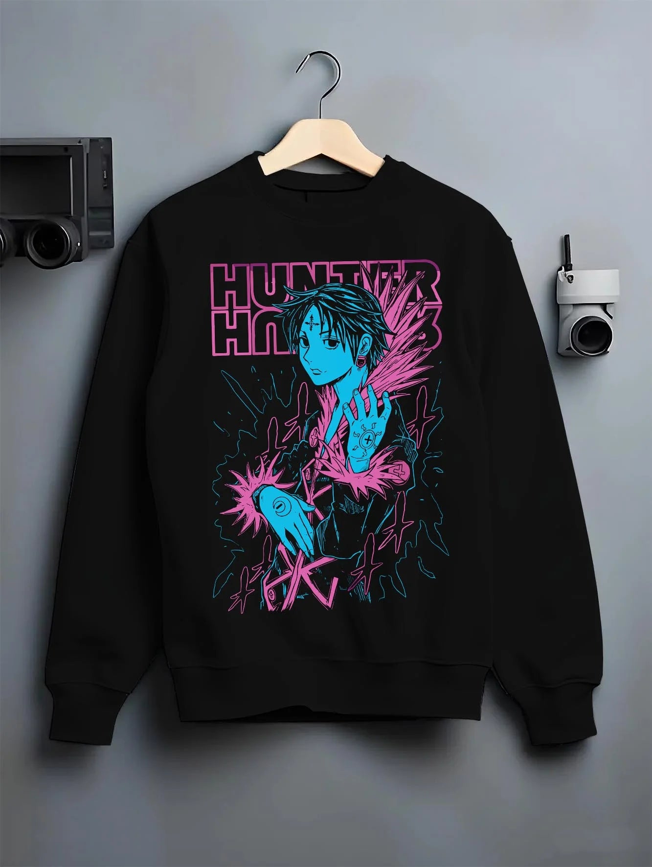 Black crewneck sweatshirt on hanger with Chrollo Hoodie Hunter x Hunter Phantom Troupe Chains graphic premium wear.