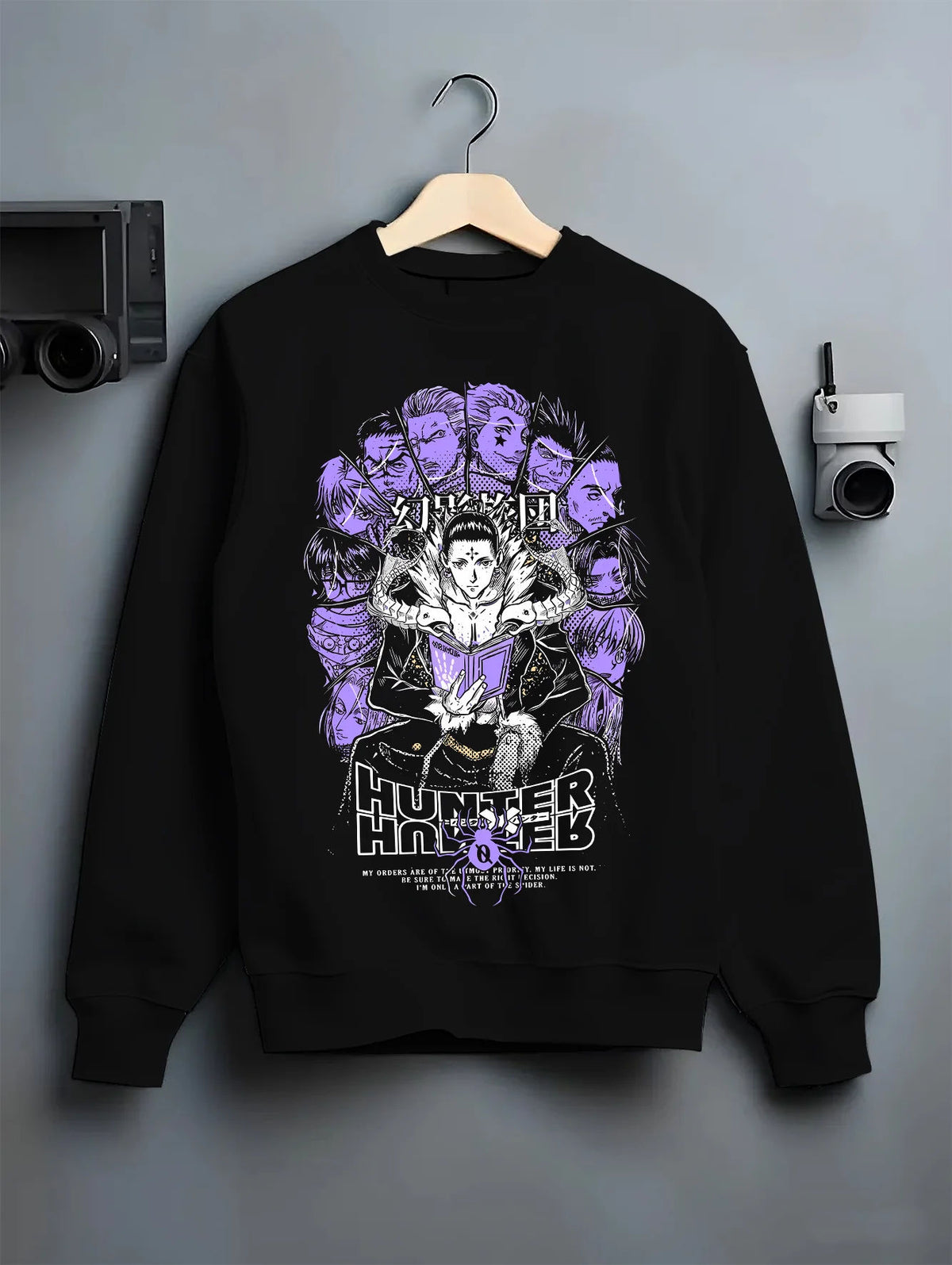 Black crewneck sweatshirt on hanger with Chrollo Lucilfer / Phantom Troupe collage from Hunter x Hunter illustrated back