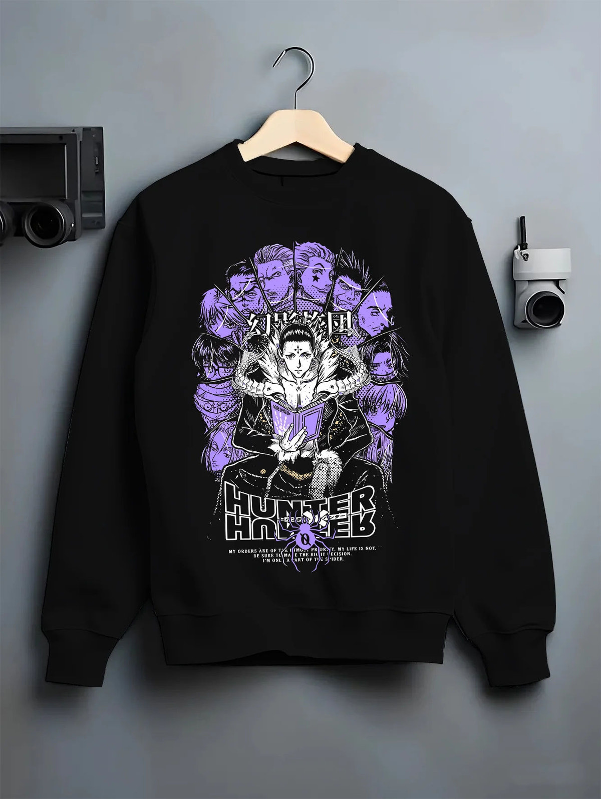 Black crewneck sweatshirt on hanger with Chrollo Lucilfer / Phantom Troupe collage from Hunter x Hunter illustrated back