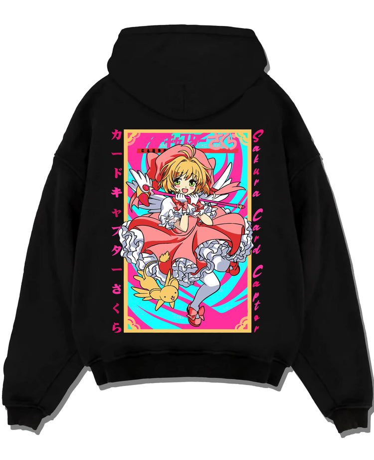 Black hoodie laid flat featuring Cardcaptor Sakura Clow Master artwork with bold anime graphic print.