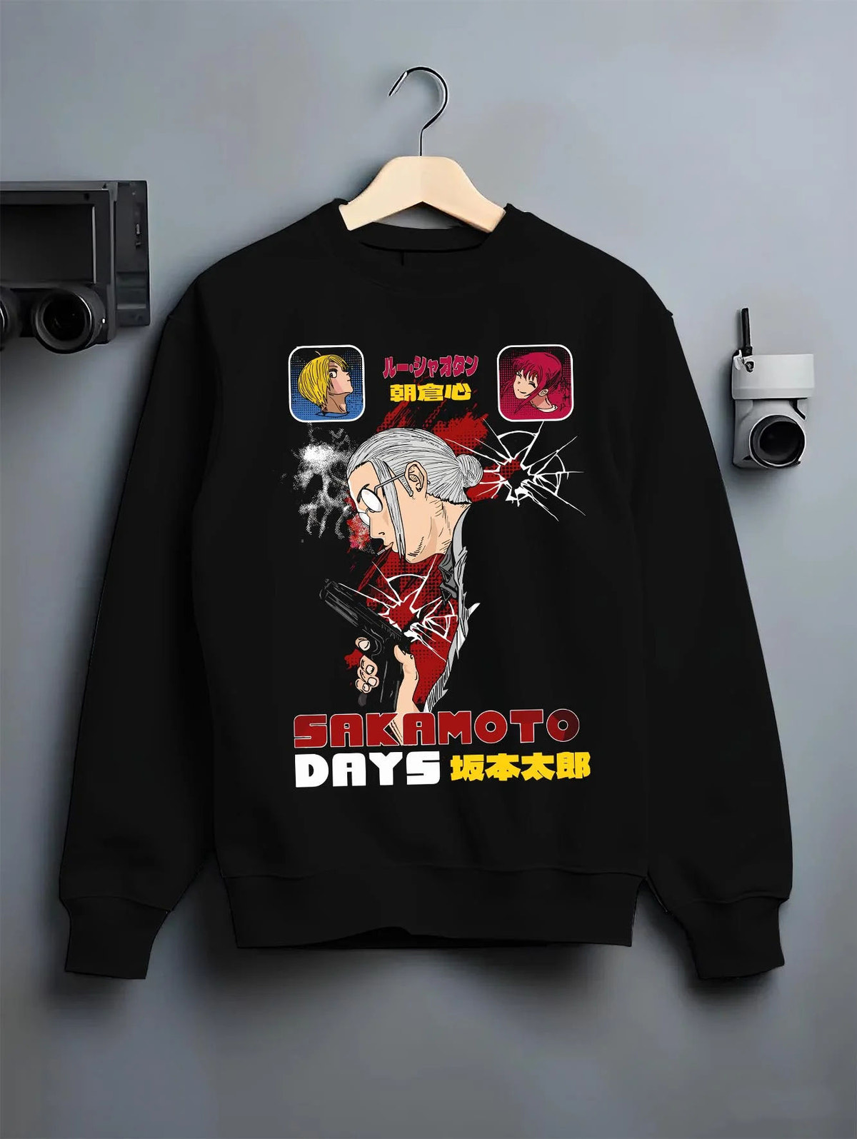 Black crewneck sweatshirt on hanger featuring Sakamoto Days combat manga artwork.
