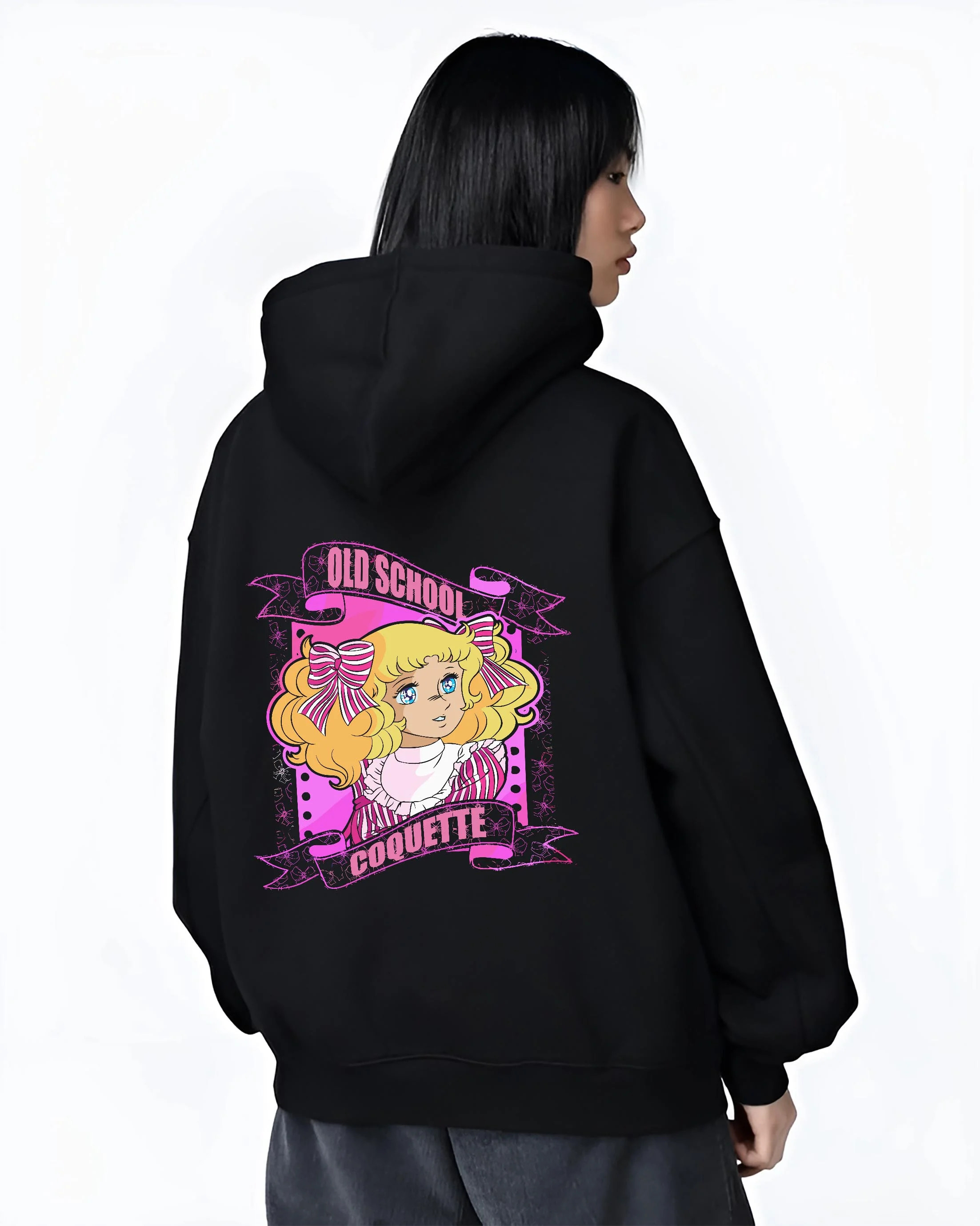 Black hoodie worn by female model, back view with Candy Candy Hoodie Retro Classic Anime Old School graphic bold anime graphic.