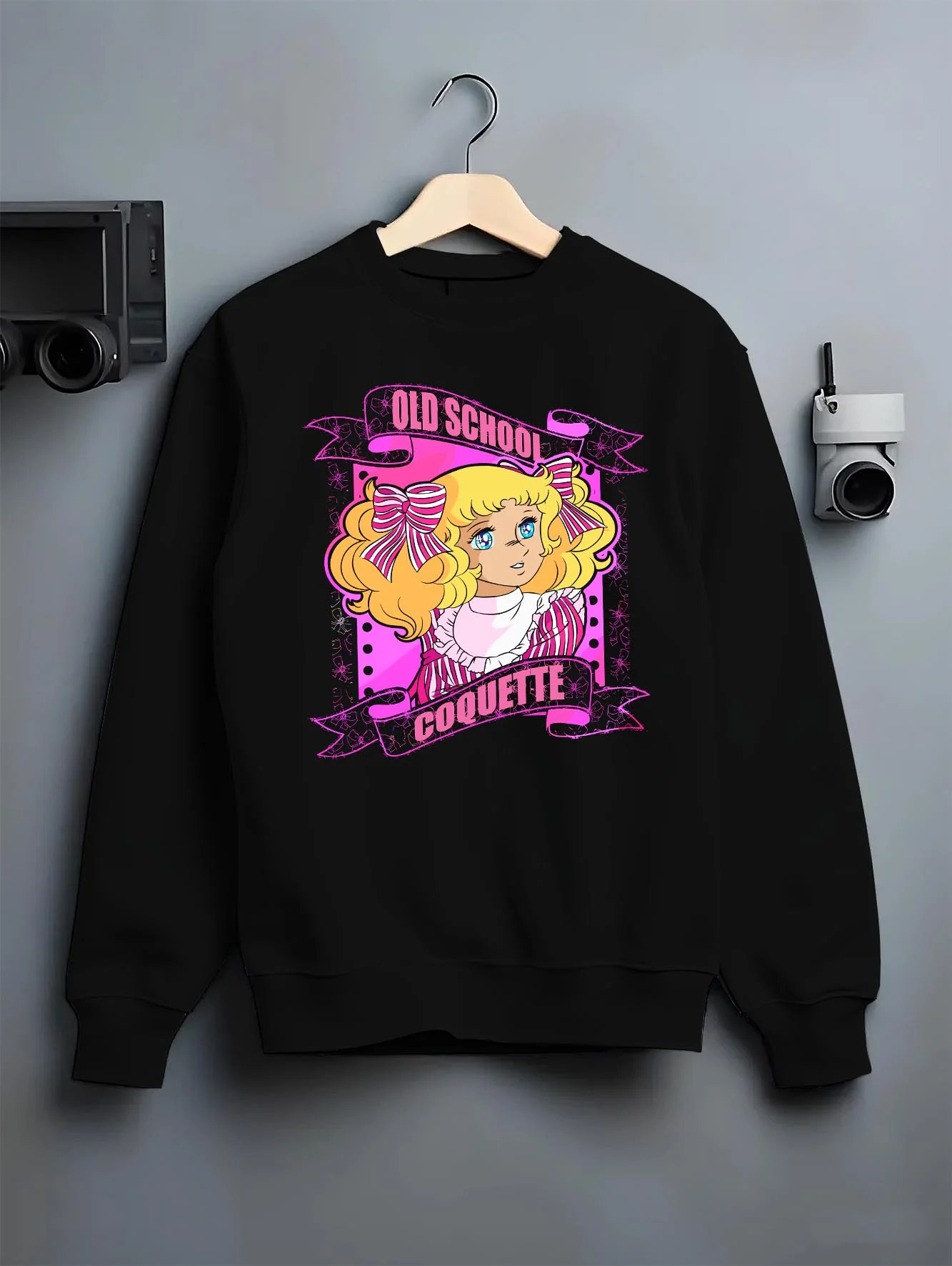 Black crewneck sweatshirt on hanger with Candy Candy Hoodie Retro Classic Anime Old School graphic streetwear graphic.