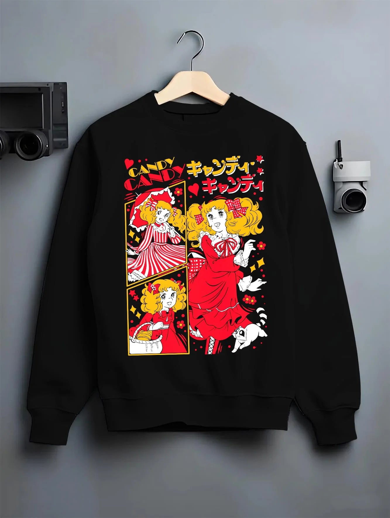 Black crewneck sweatshirt on hanger with Candy Candy Hoodie Retro Anime Red Dress Twin Scene graphic Candy anime design.