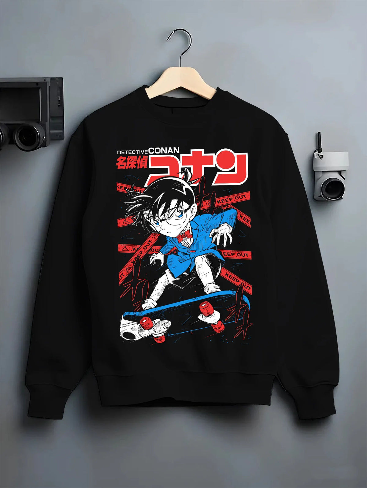 Black crewneck sweatshirt on hanger with Conan Edogawa from Detective Conan illustrated back graphic