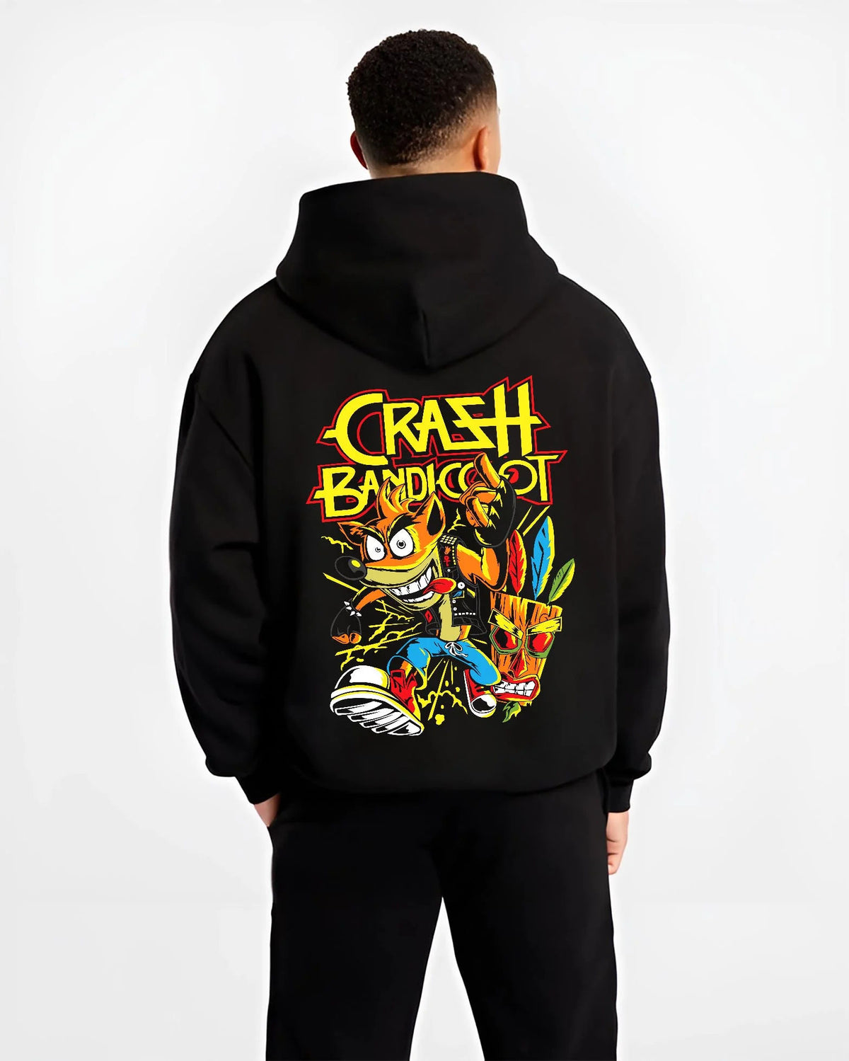 Black hoodie worn by male model from the back featuring Crash Bandicoot retro gaming spin action artwork.