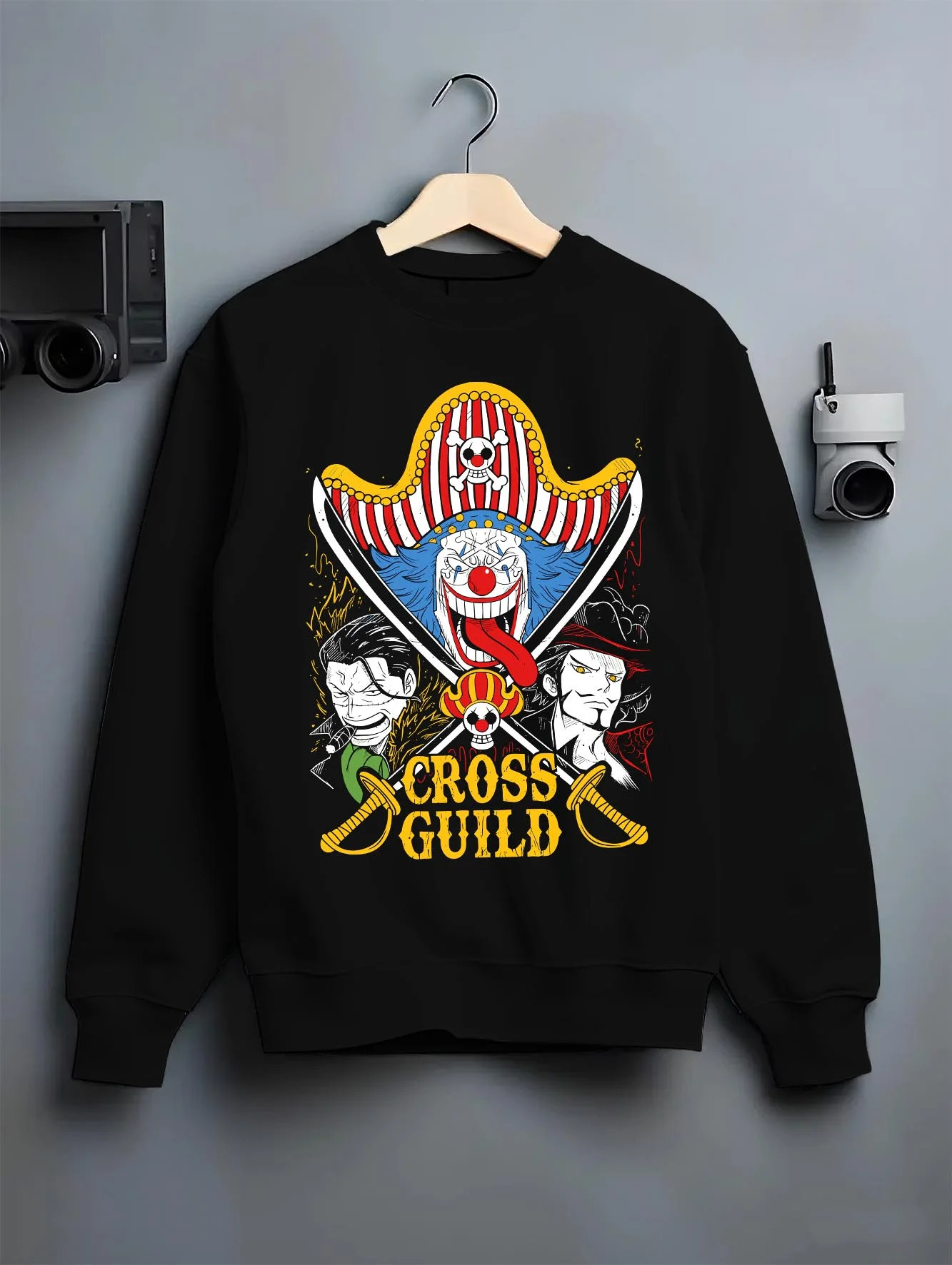Black crewneck sweatshirt on hanger with Cross Guild Hoodie One Piece Buggy Mihawk Crocodile graphic streetwear graphic.