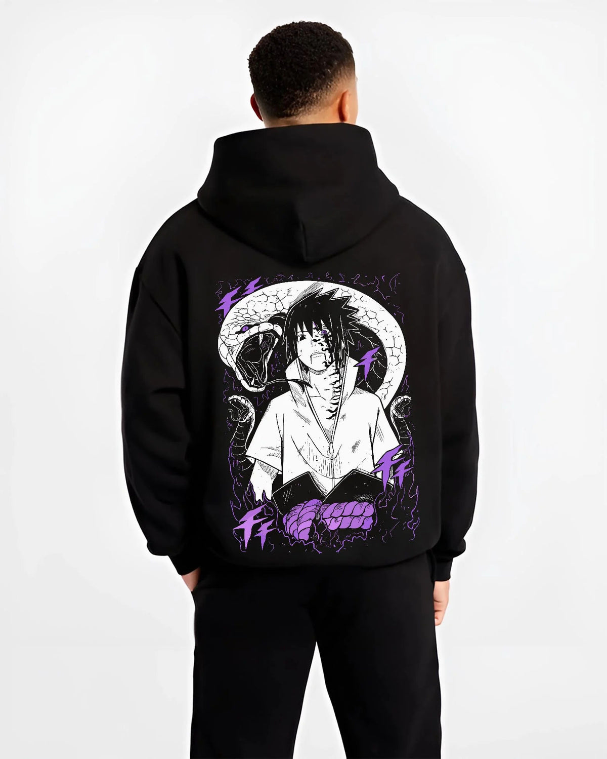 Black hoodie worn by male model from the back featuring Sasuke Uchiha Naruto curse mark power artwork.