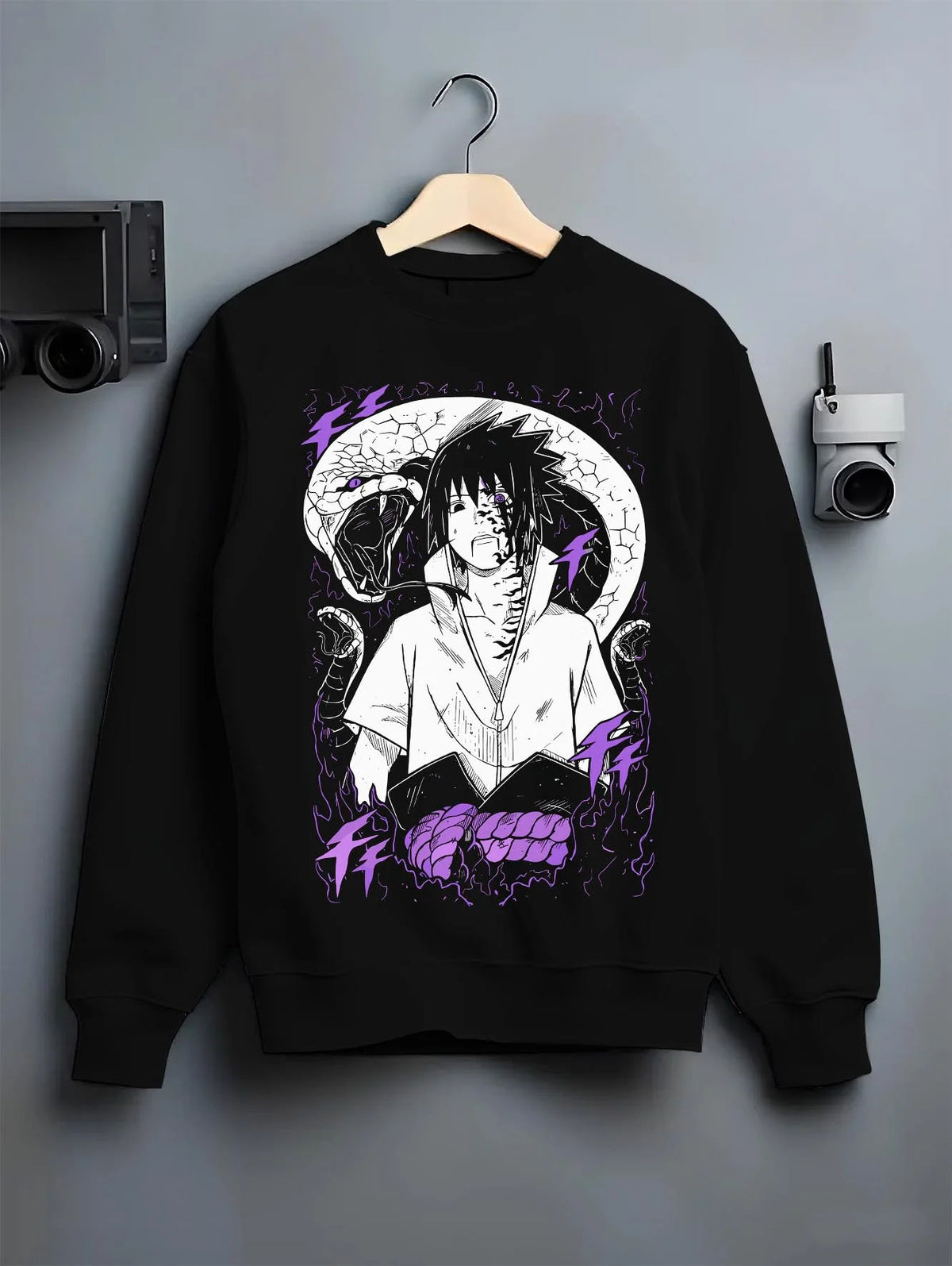 Black crewneck sweatshirt on hanger featuring Sasuke Uchiha Naruto curse mark power artwork.
