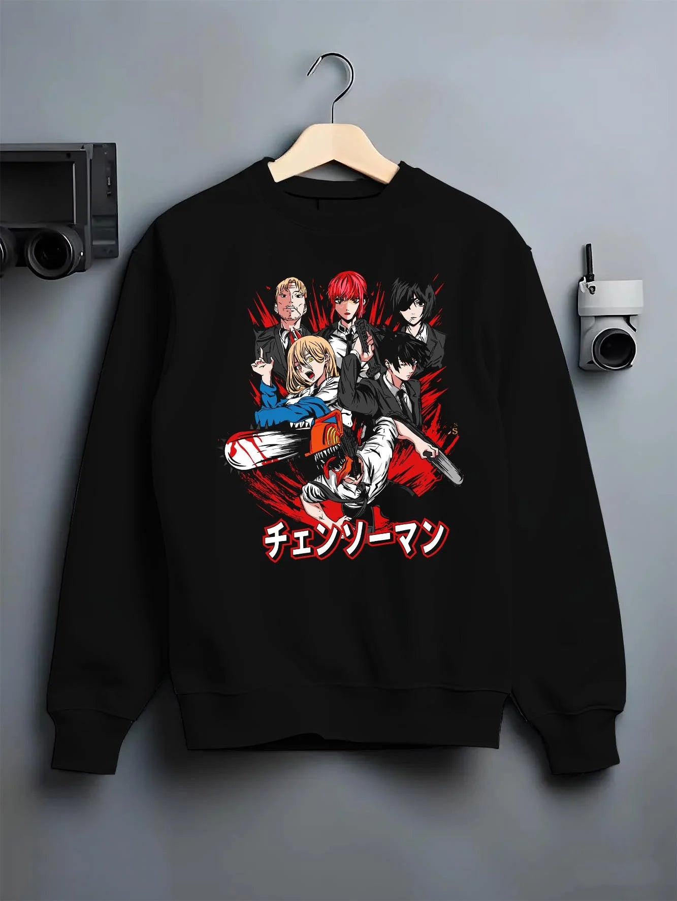 Black crewneck sweatshirt on hanger with Chainsaw Man Hoodie Katana Man Devil Hunter Villain graphic premium wear.