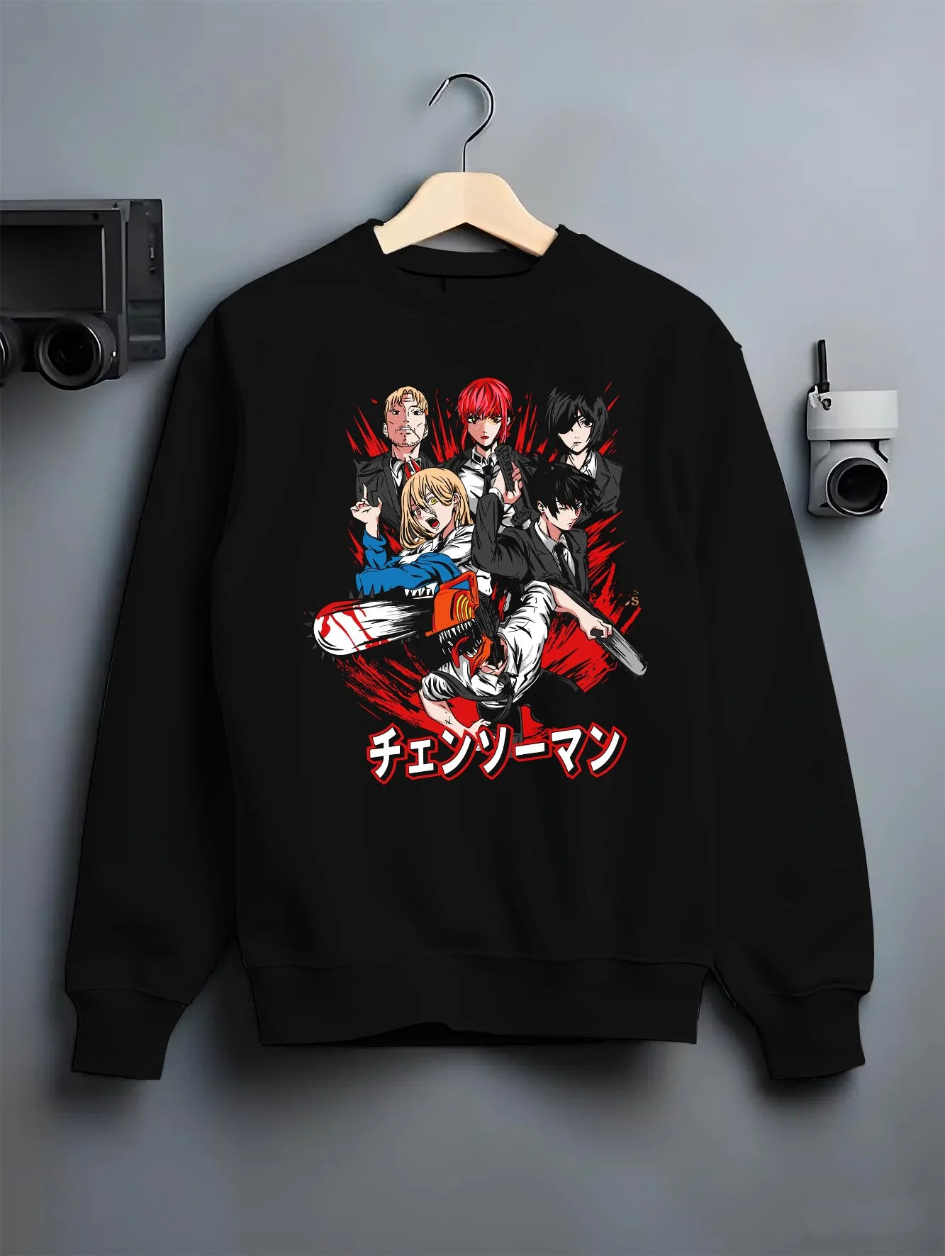 Black crewneck sweatshirt on hanger with Chainsaw Man Hoodie Katana Man Devil Hunter Villain graphic premium wear.