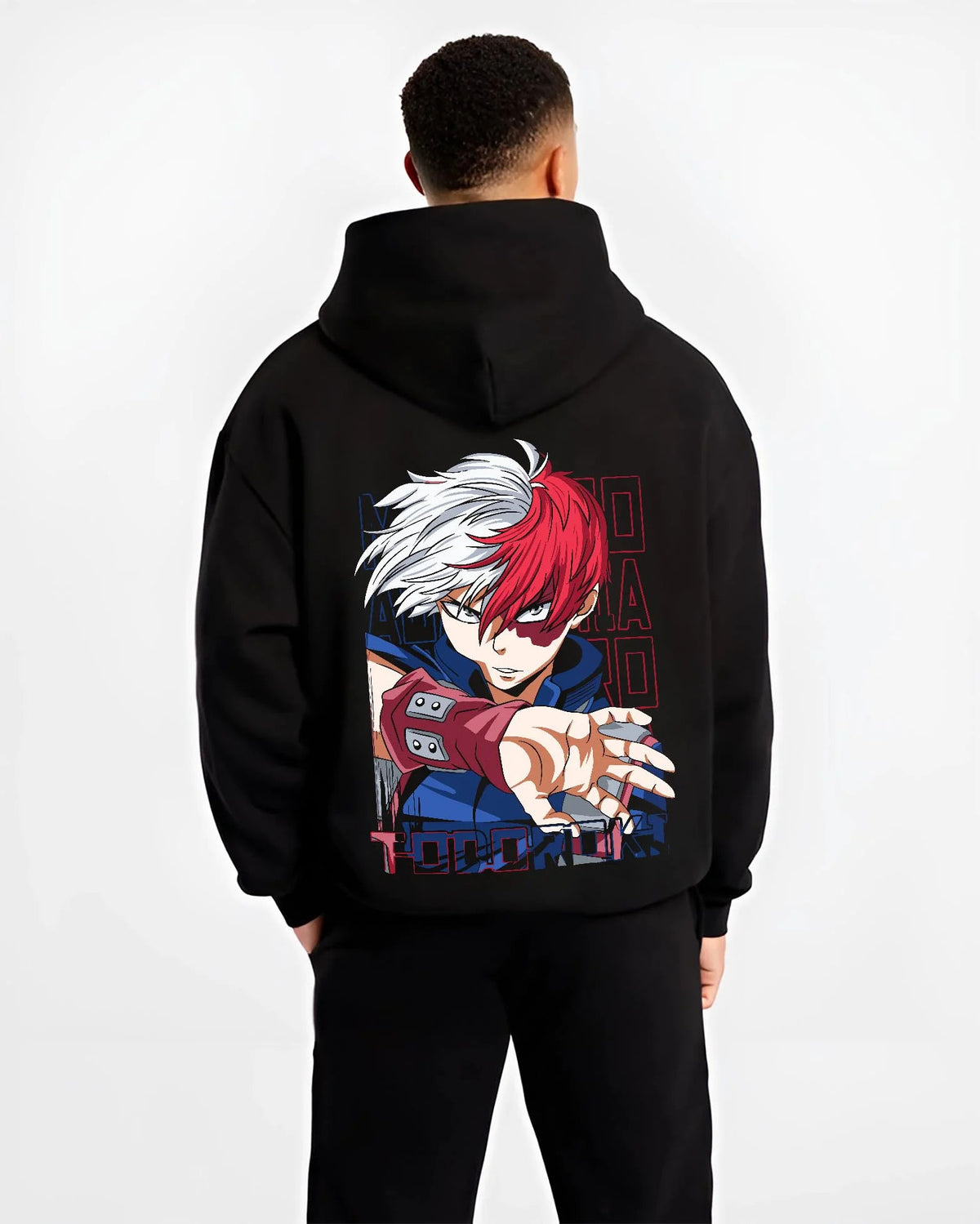 Black hoodie worn by male model from the back featuring Shoto Todoroki My Hero Academia fire and ice artwork.