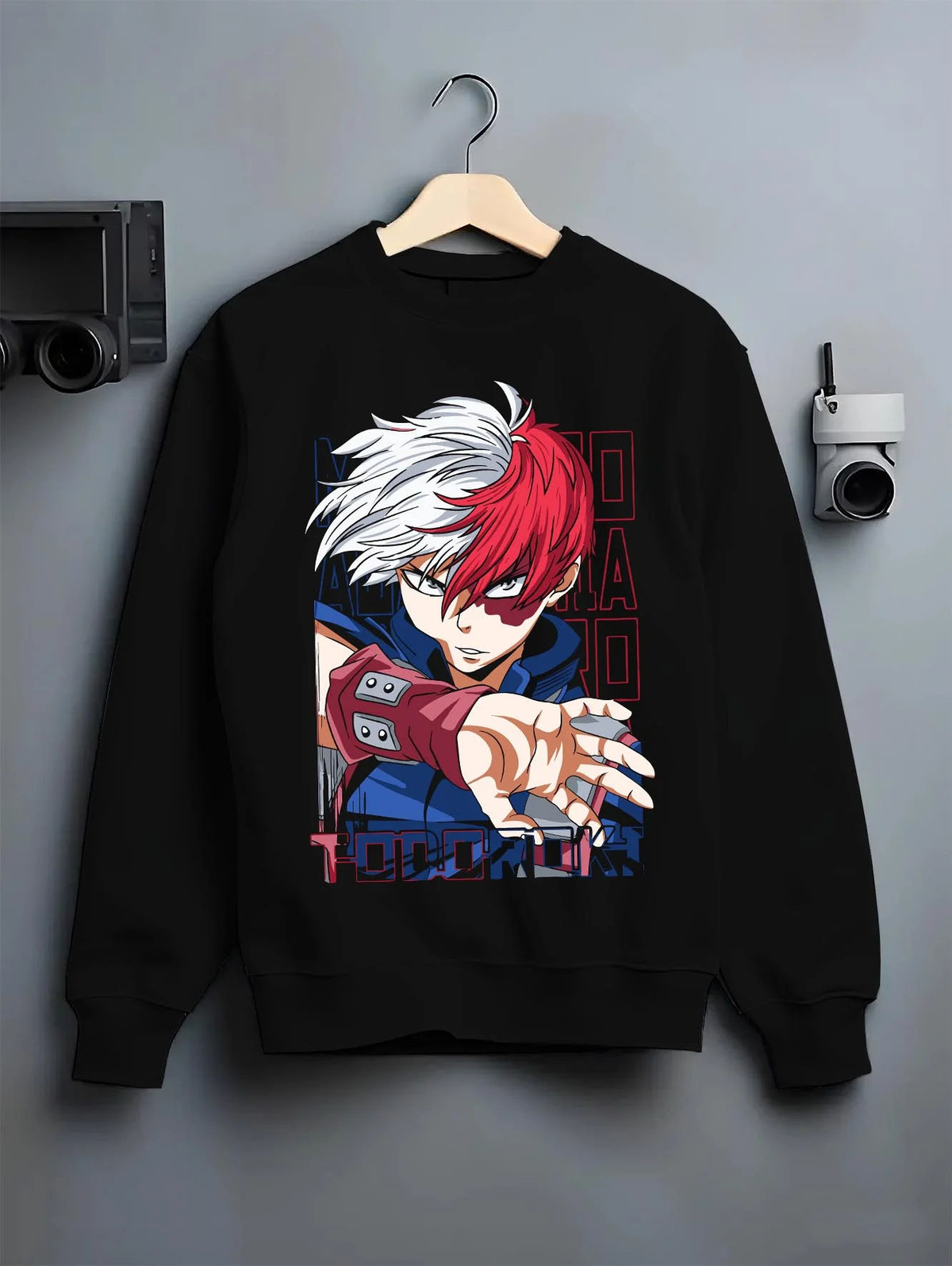 Black crewneck sweatshirt on hanger featuring Shoto Todoroki My Hero Academia fire and ice artwork.