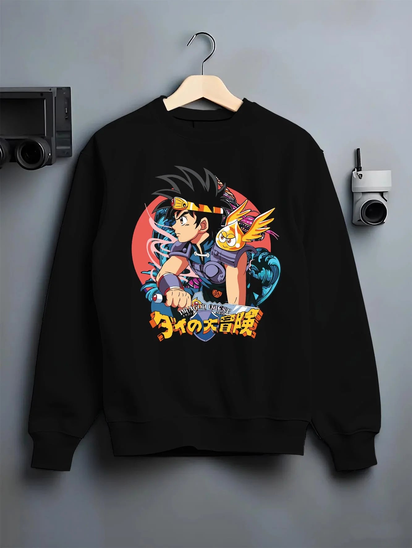 Black crewneck sweatshirt on hanger with Dai Hoodie Dragon Quest Hero Sword Retro Anime Print graphic streetwear graphic.