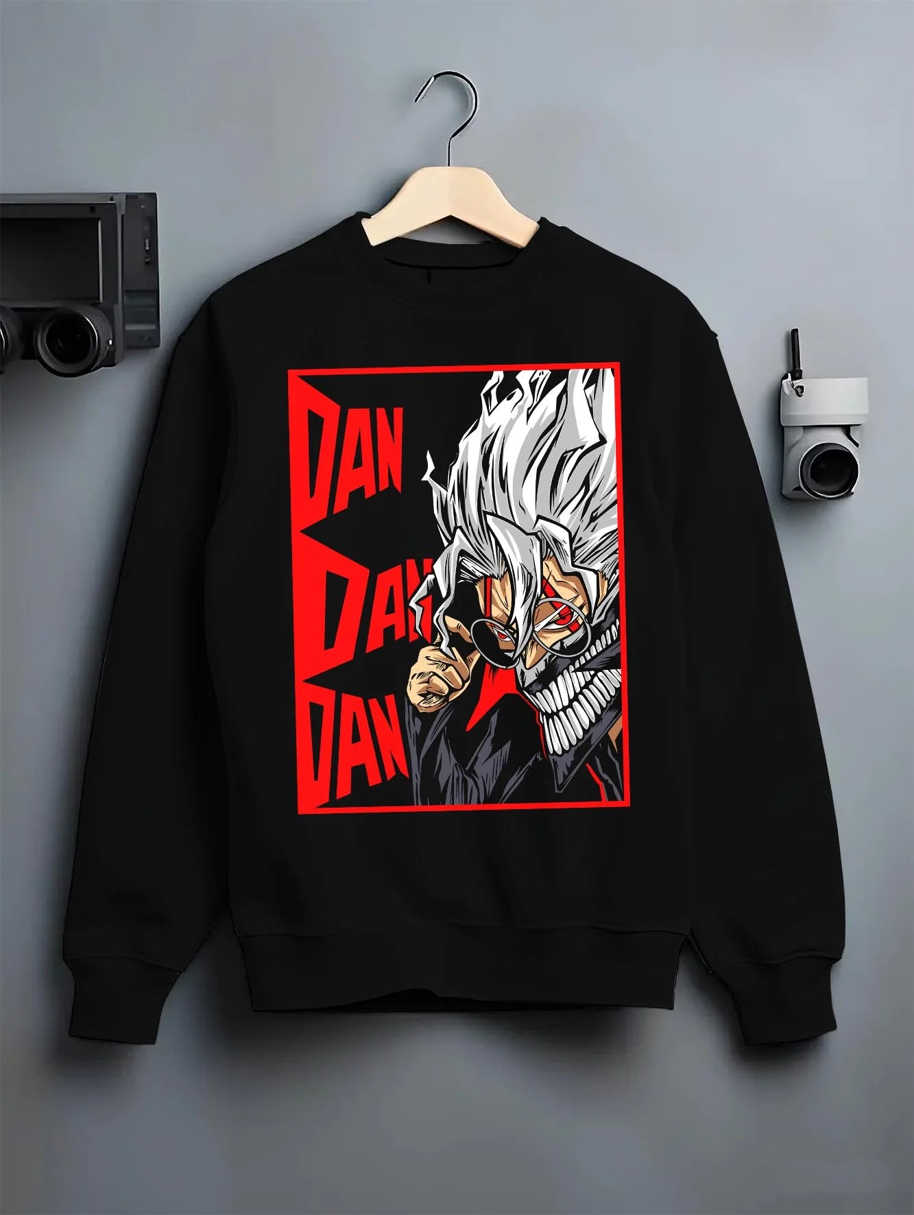 Black crewneck sweatshirt on hanger with Ken Spirit Clash Hoodie Dandadan Turbo Granny Mode graphic premium wear.