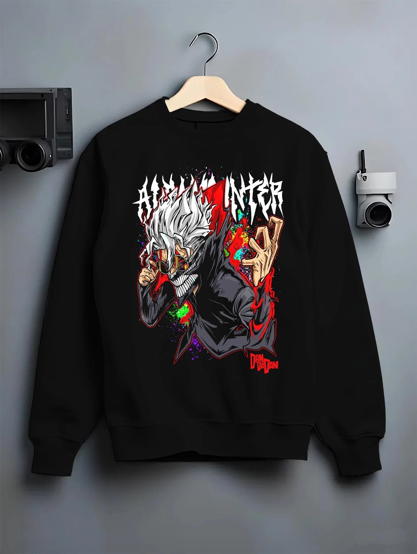 Black crewneck sweatshirt on hanger with Ken Turbo Form Hoodie Dandadan Supernatural Fight graphic premium wear.