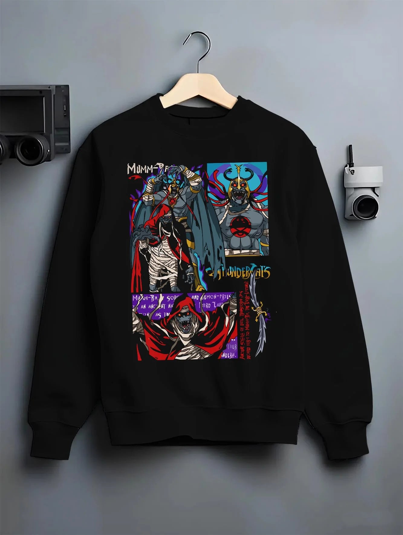 Black crewneck sweatshirt on hanger with ThunderCats Mumm-Ra Dark Sorcerer Villain Jumper graphic streetwear graphic.