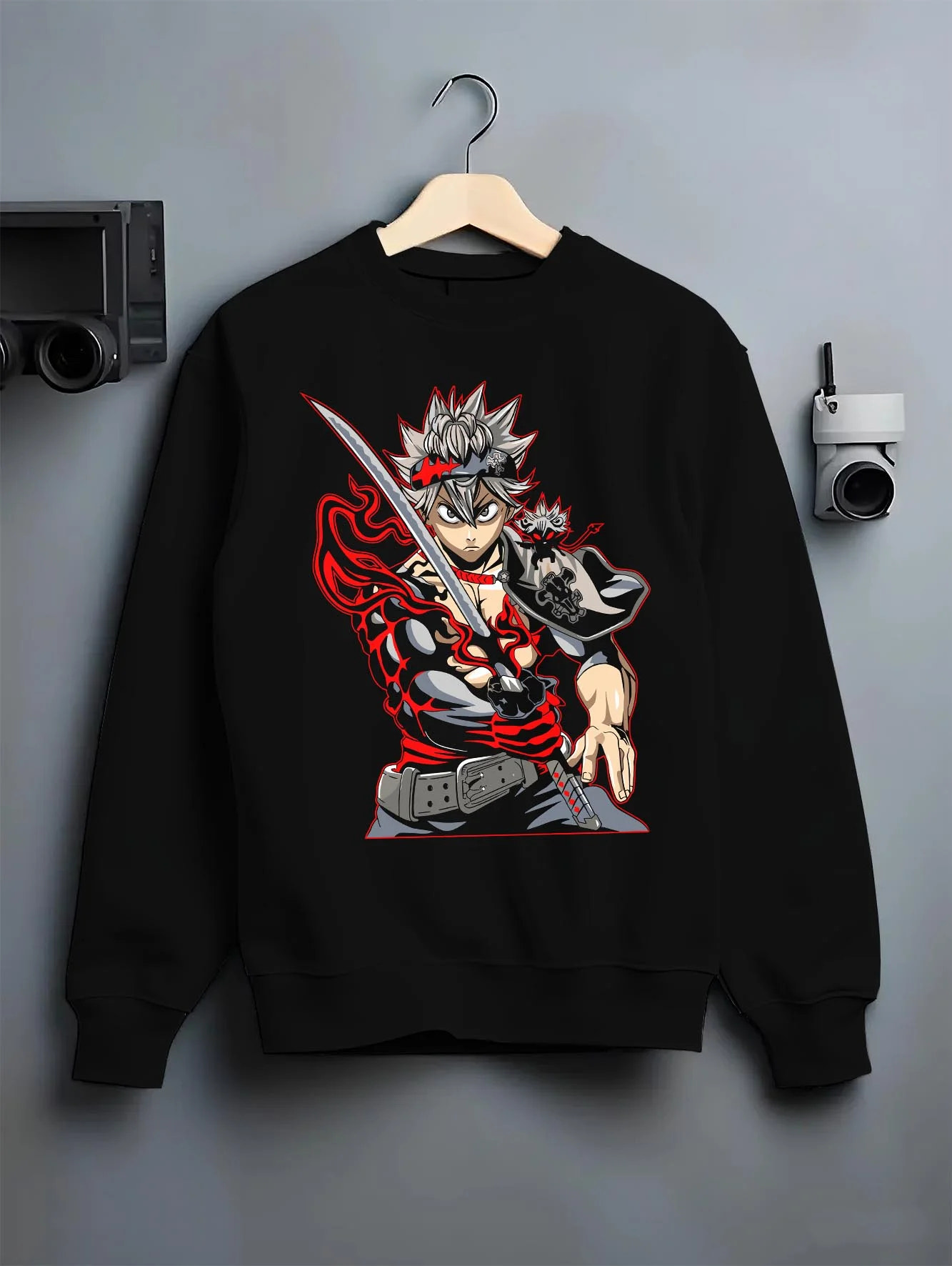 Black crewneck sweatshirt on hanger with Asta Hoodie Black Clover Sword Demon Form Cursed Fire graphic premium wear.