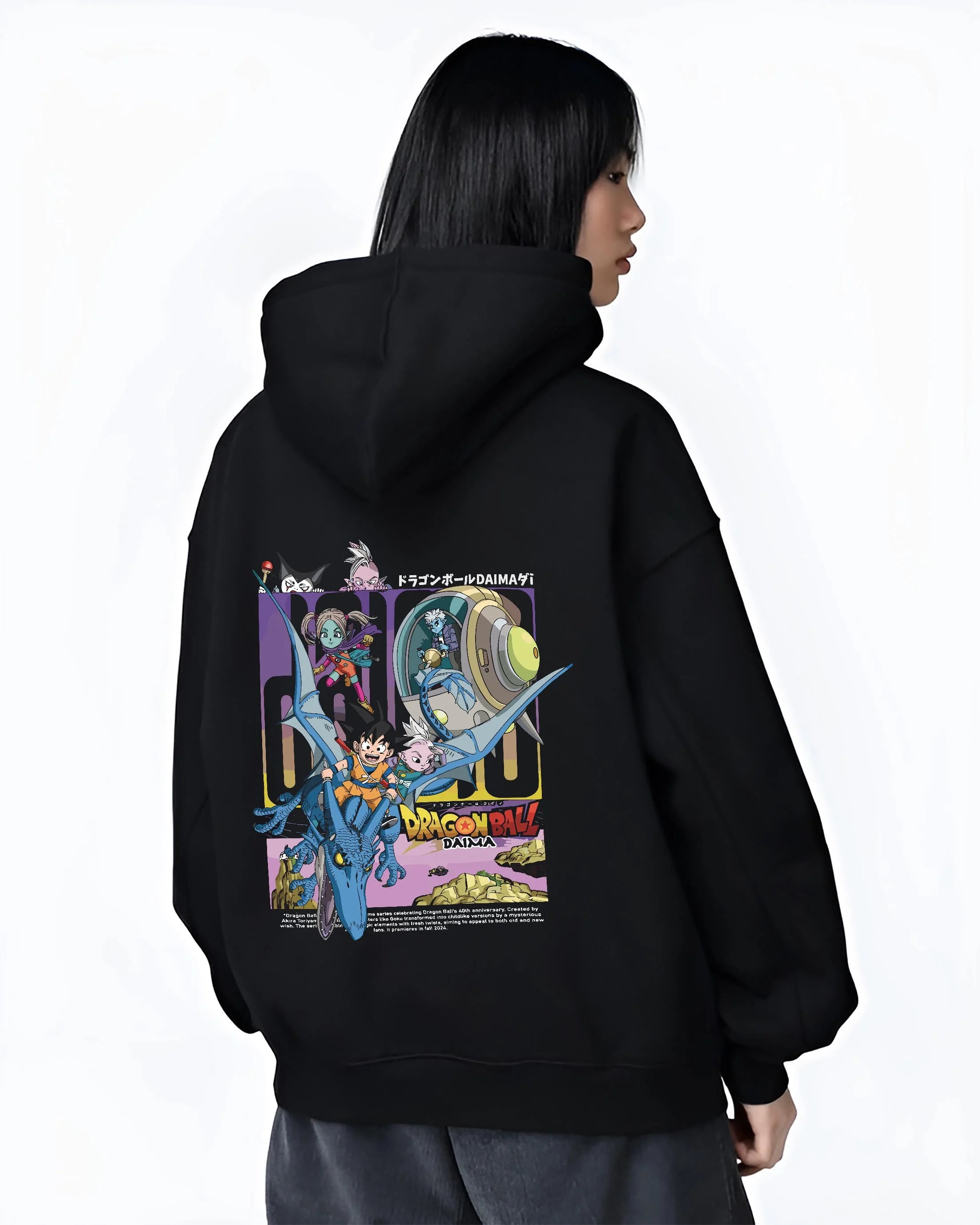 Black hoodie worn by female model, back view with Dragon Ball Hoodie Daima Anime Retro Poster Scene graphic Goku themed artwork.