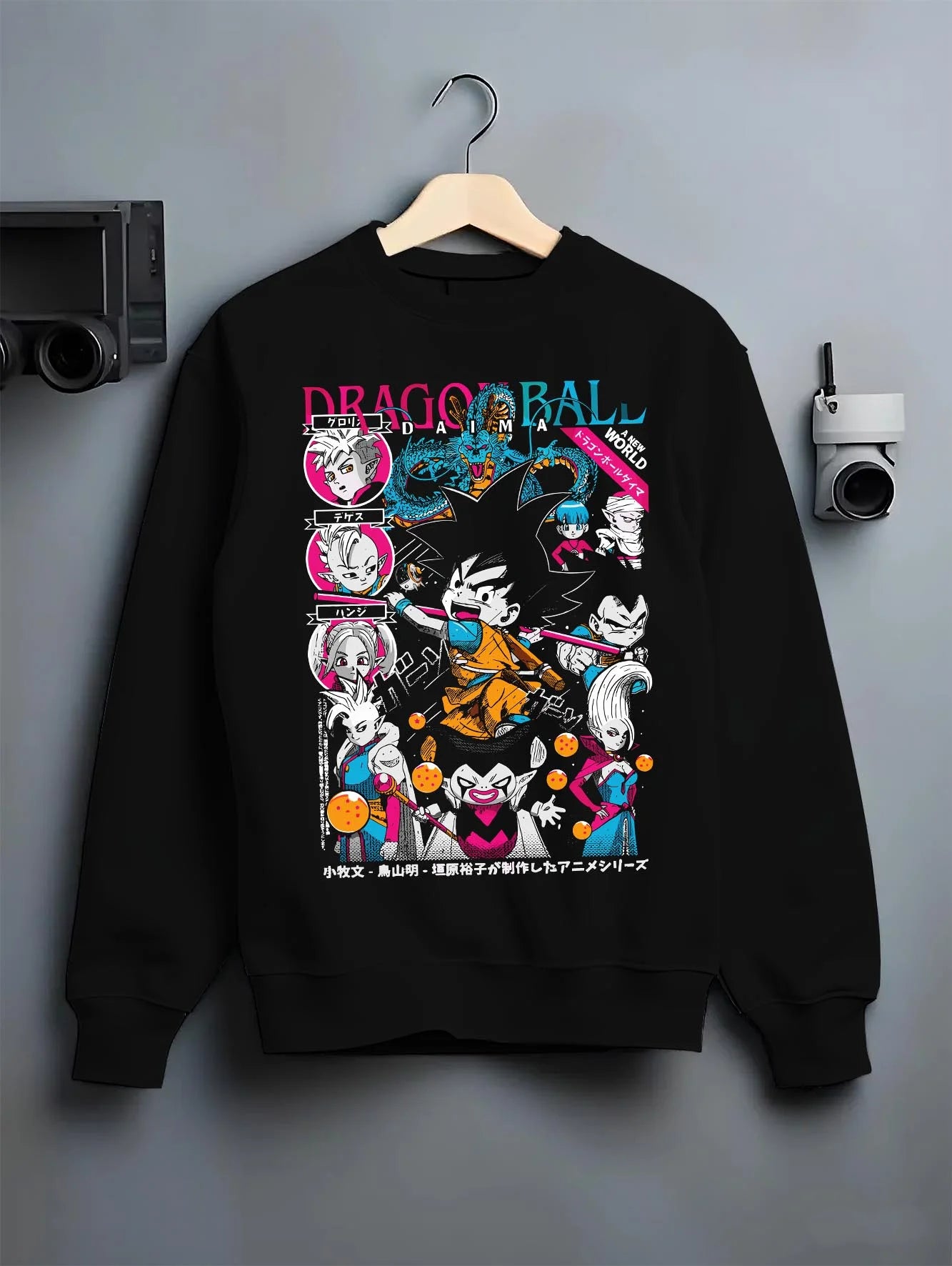 Black crewneck sweatshirt on hanger with Goku Adventure Hoodie Dragon Ball Daima Hero Anime graphic premium wear.