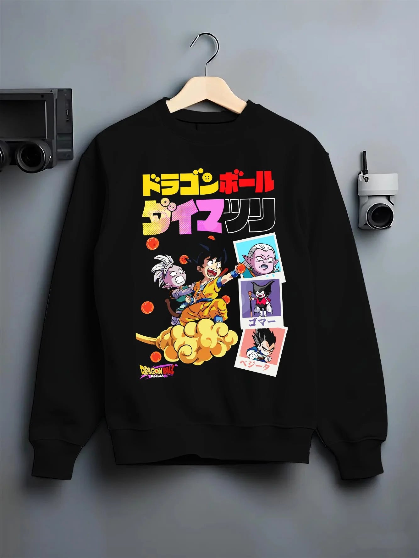 Black crewneck sweatshirt on hanger with Majin Buu Hoodie Dragon Ball Z Fat Buu Retro Panel graphic Goku themed artwork.