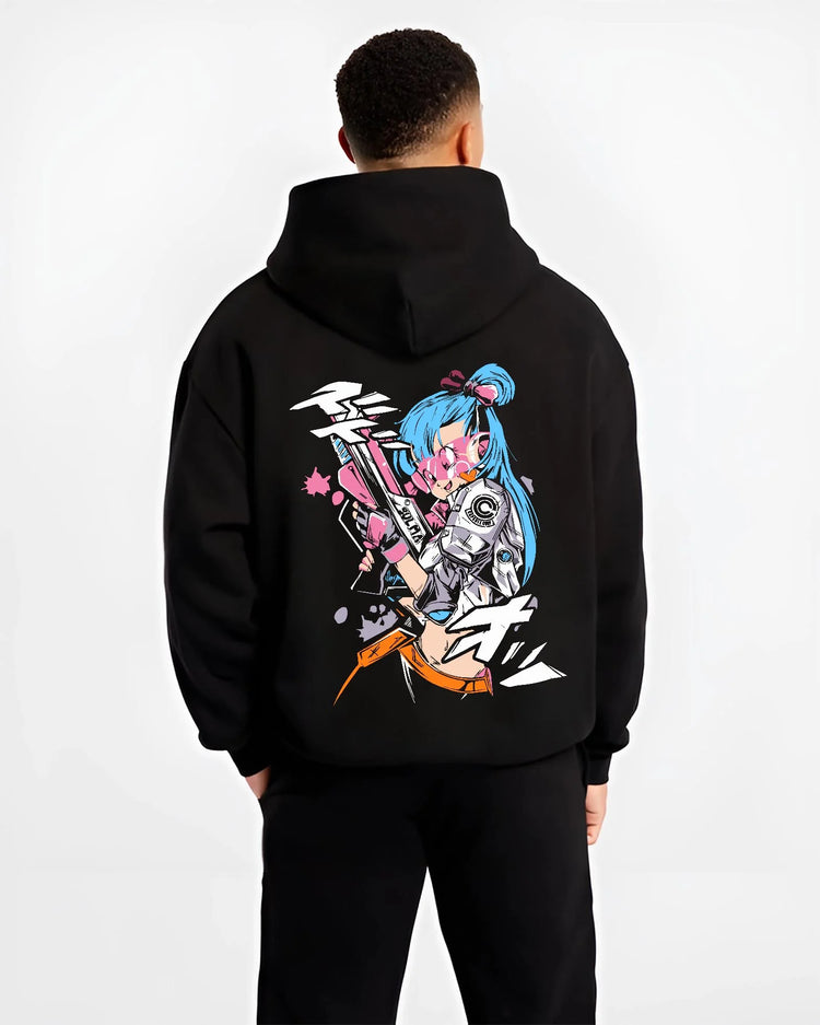 Black hoodie worn by male model, back view with Bulma Hoodie Dragon Ball Retro Capsule Corp Scene graphic premium wear.