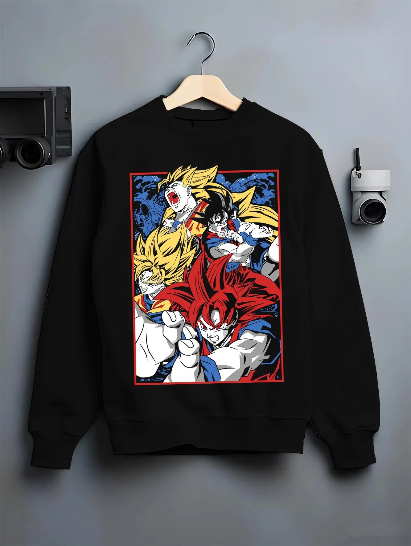 Black crewneck sweatshirt on hanger with Goku Hoodie Dragon Ball Z Saiyan Transform Battle graphic premium wear.