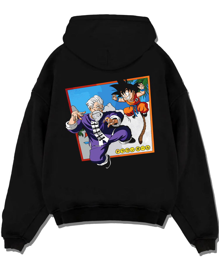 Black pullover hoodie laid flat with Dragon Ball Hoodie Goku Training Retro Anime Panel graphic bold anime graphic.