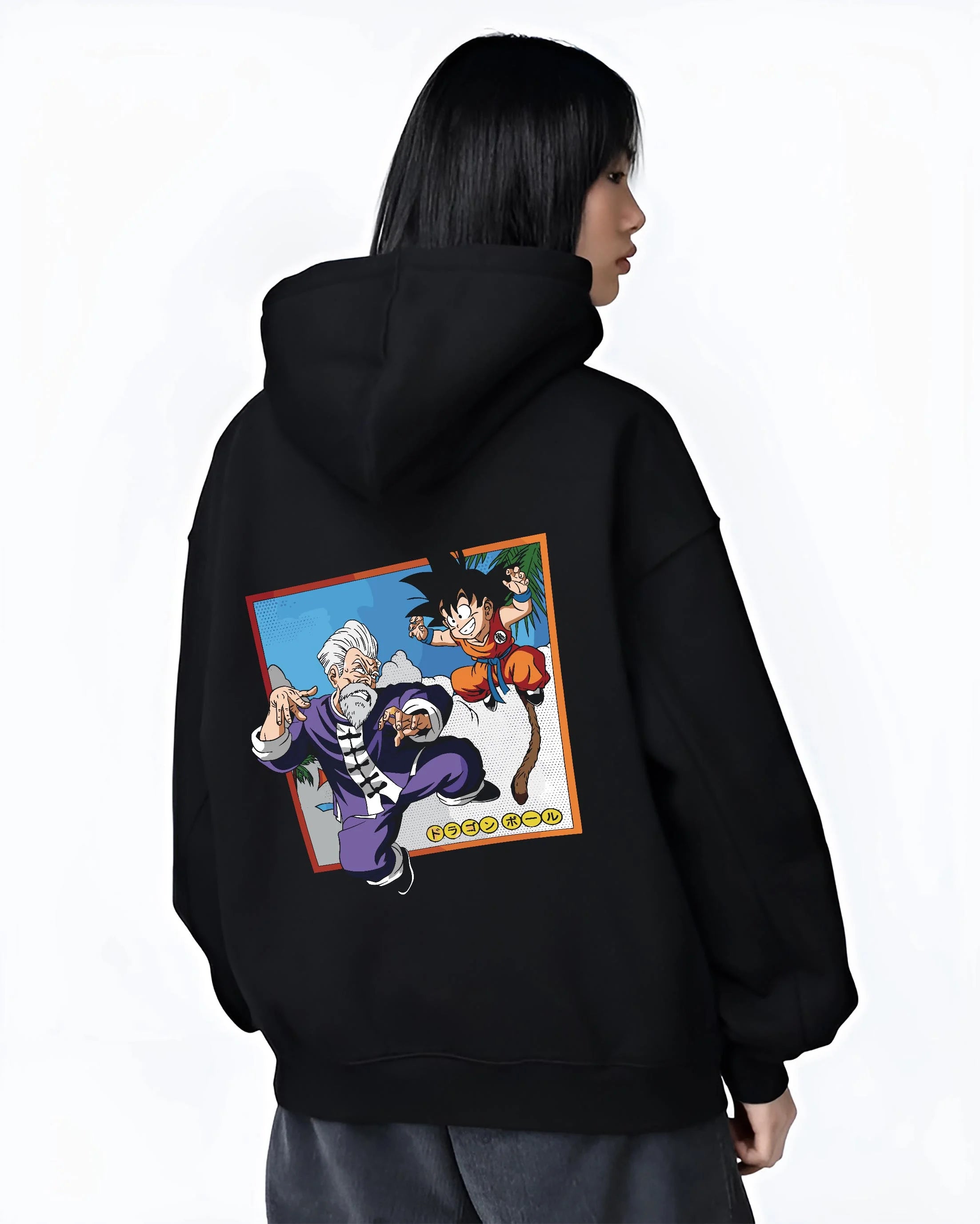 Black hoodie worn by female model, back view with Dragon Ball Hoodie Goku Training Retro Anime Panel graphic bold anime graphic.