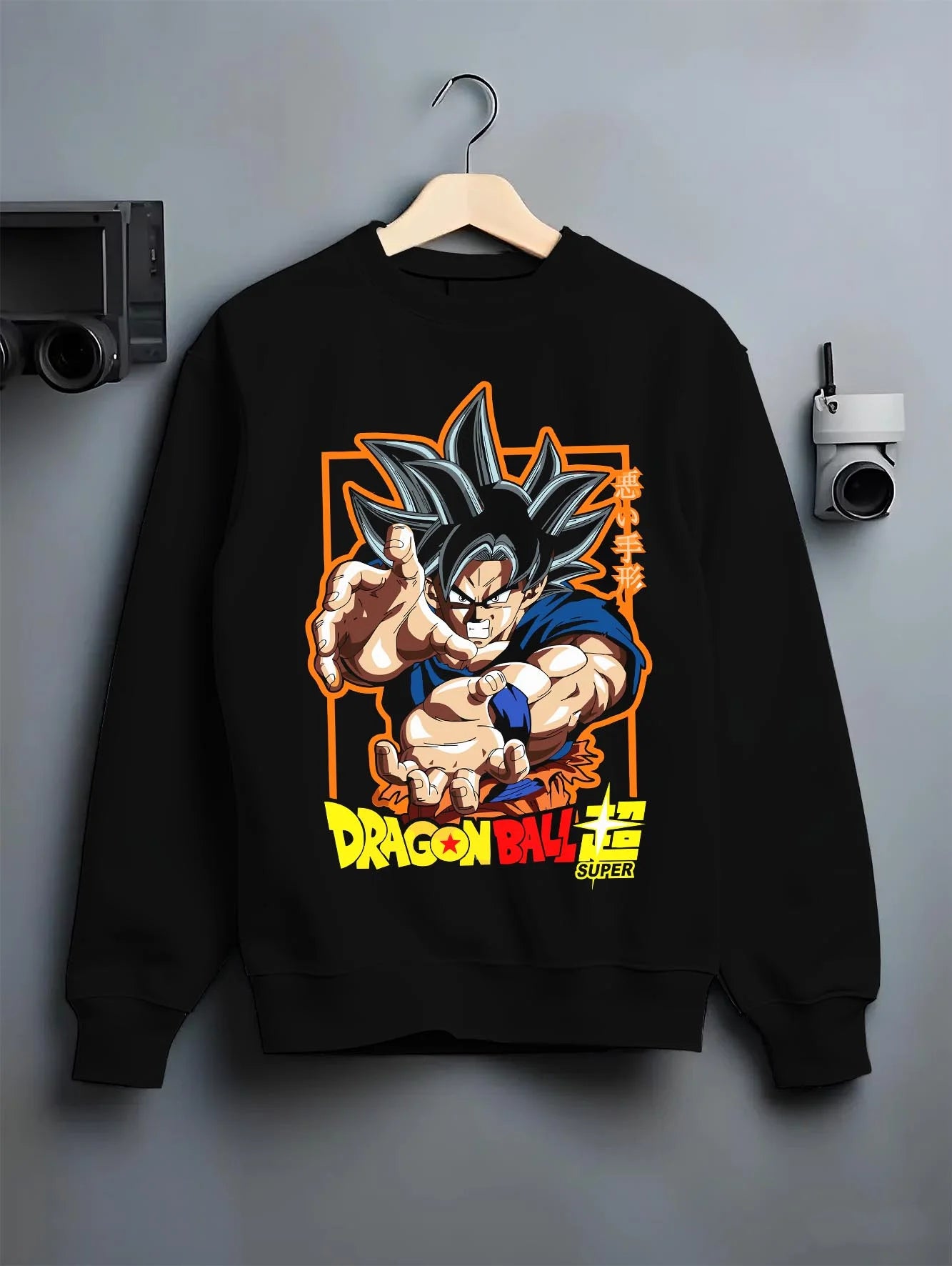 Black crewneck sweatshirt on hanger with Goku Hoodie Dragon Ball Super Ultra Instinct Power graphic Goku anime design.