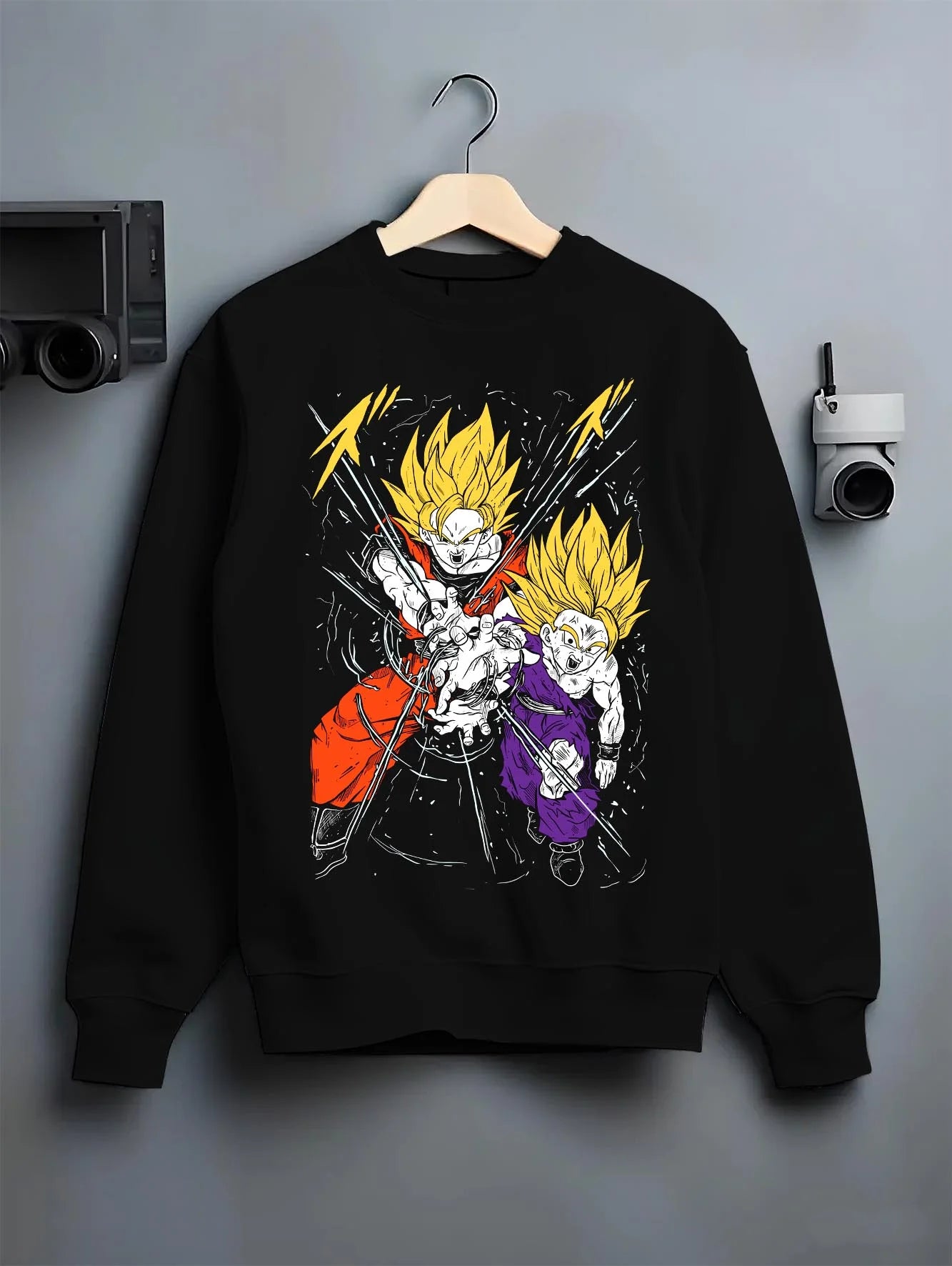 Black crewneck sweatshirt on hanger with Gohan Hoodie Dragon Ball Z Super Saiyan Rage Clash graphic bold anime graphic.