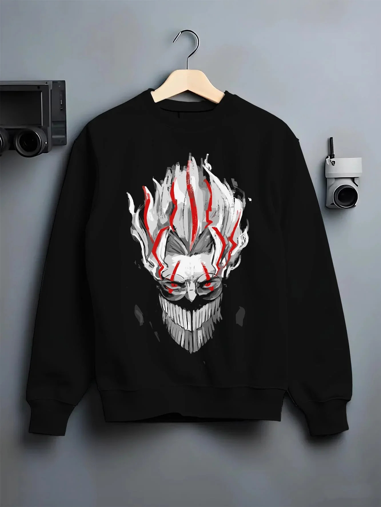 Black crewneck sweatshirt on hanger with Dandadan Hoodie Paranormal Spirit Ghostly Red Scene graphic bold anime graphic.