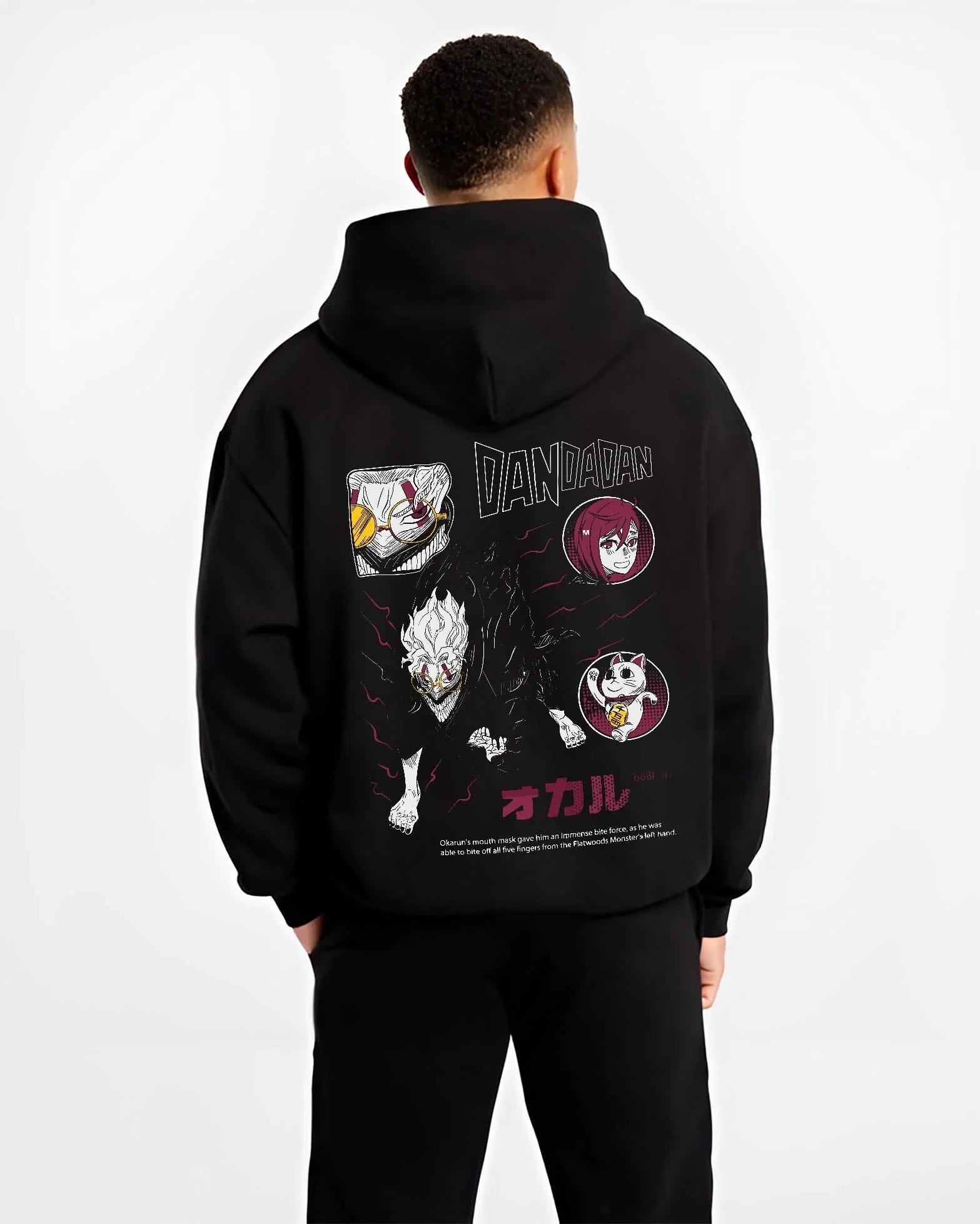Black hoodie worn by male model, back view with Dandadan Hoodie Paranormal Battle Horror Retro Print graphic bold anime graphic.