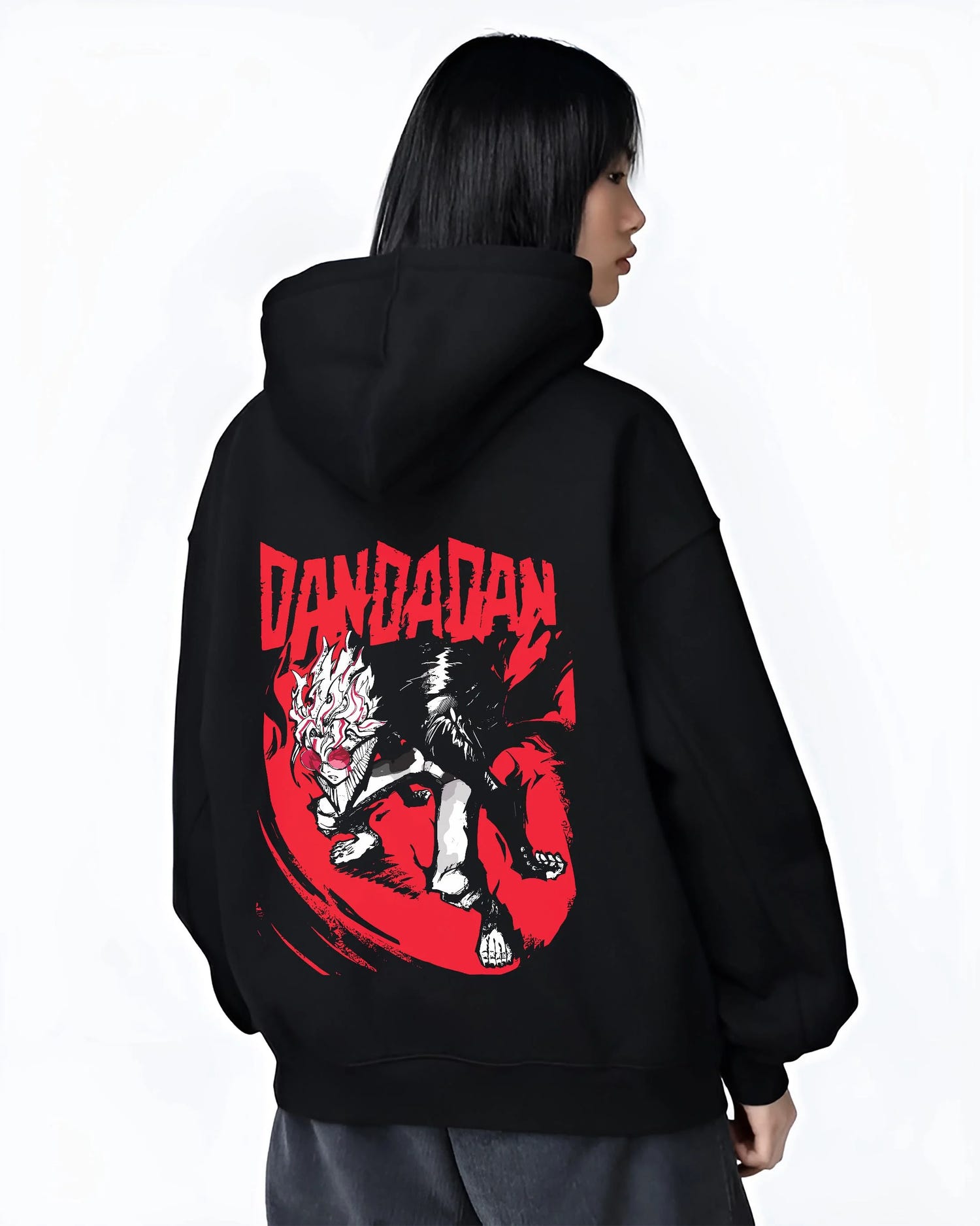 Black hoodie worn by female model, back view with Dandadan Hoodie Retro Anime Occult Spirit Adventure graphic nan themed artwork.