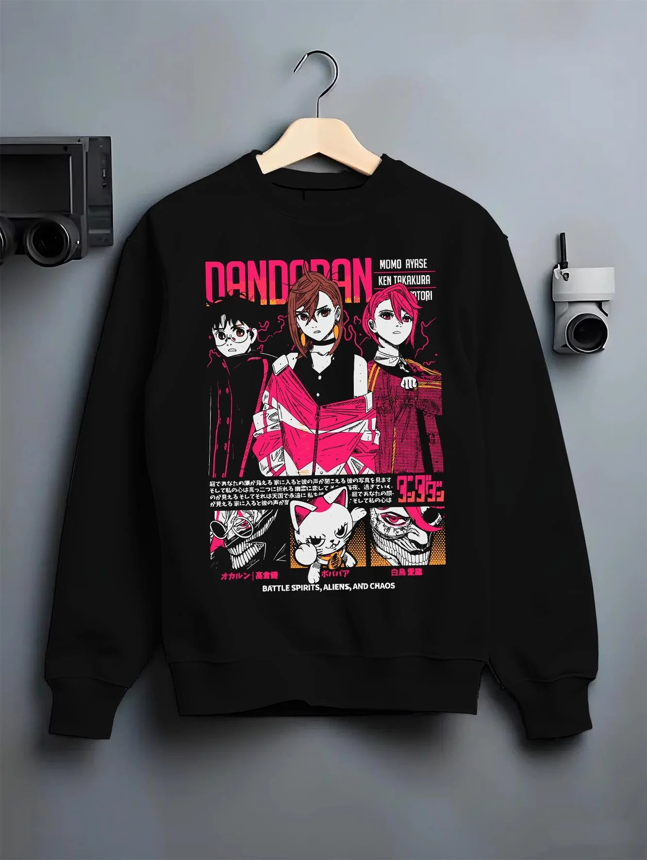 Black crewneck sweatshirt on hanger with Dandadan Hoodie Paranormal Duo Retro Anime Poster graphic premium wear.