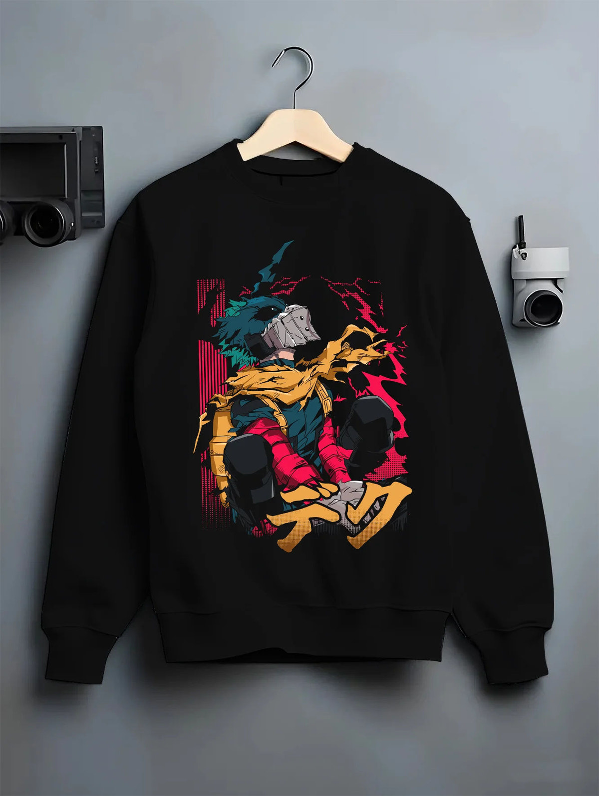Black crewneck sweatshirt on hanger showing Izuku Midoriya from My Hero Academia: hooded rogue/vigilante, sitting pose