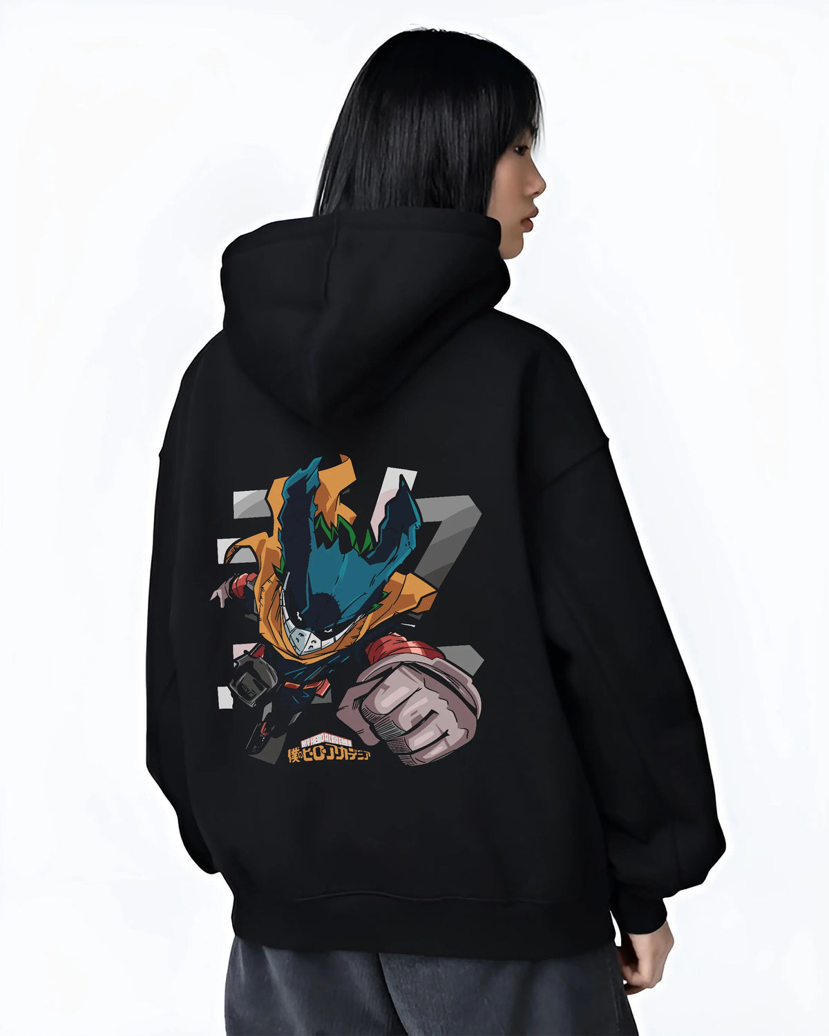 Black hoodie female model back view showing Deku from My Hero Academia: stylised chibi hero suit with extended fist