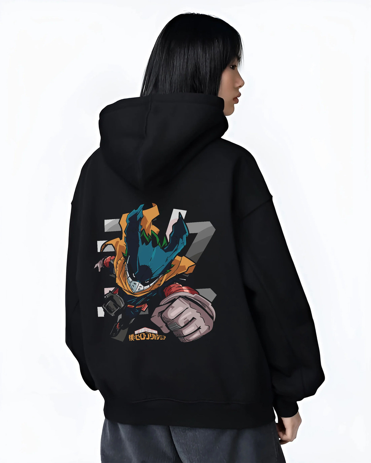 Black hoodie female model back view showing Deku from My Hero Academia: stylised chibi hero suit with extended fist